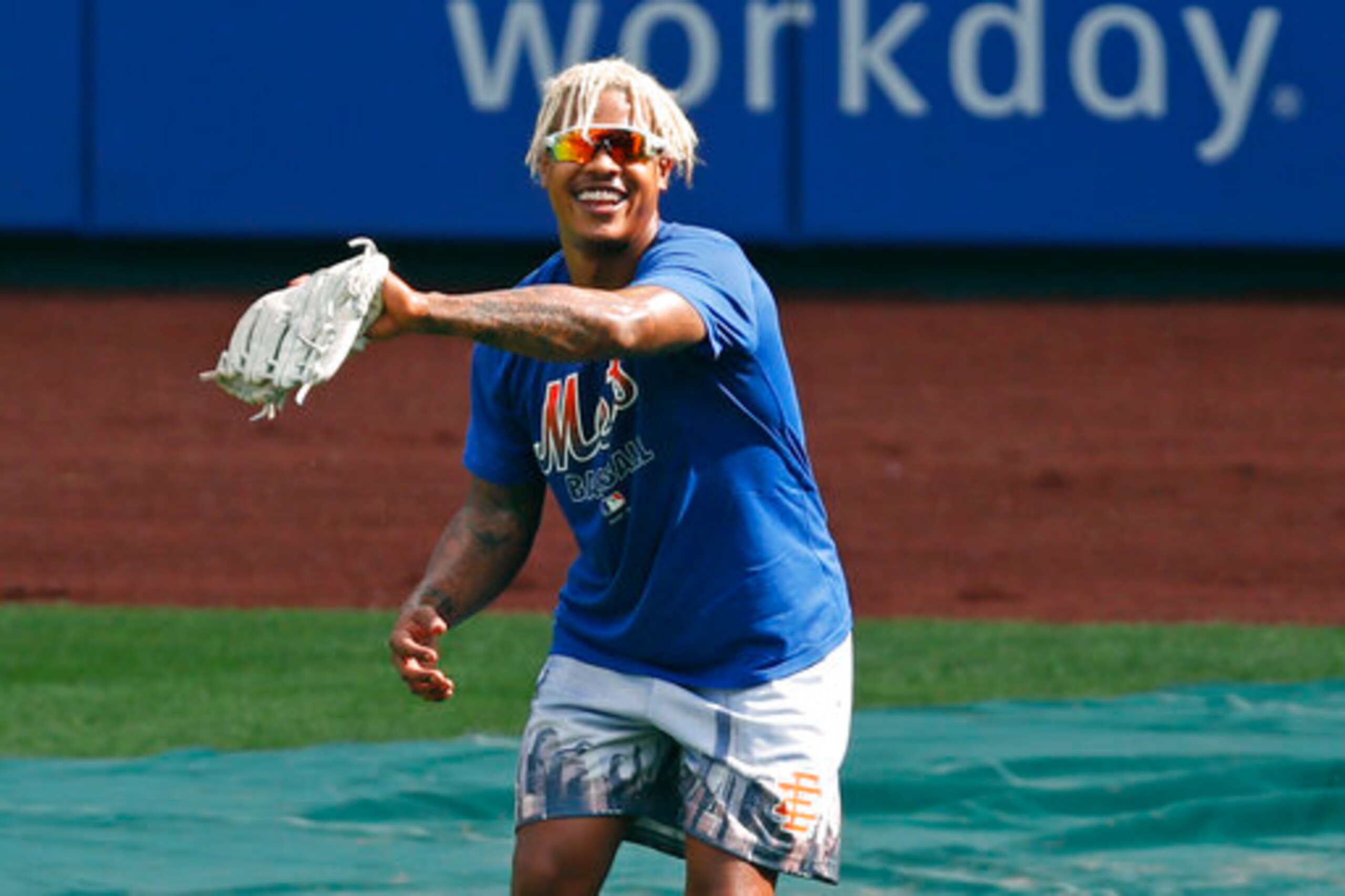 New York Mets starting pitcher Marcus Stroman practices his fielding during a baseball workout at Citi field, Thursday, July 9, 2020, in New York. (AP Photo/Kathy Willens)