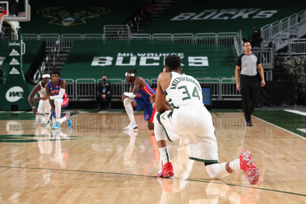 MILWAUKEE, WI - JANUARY 6:  The players kneel during the game on January 6, 2021 at the Fiserv Forum Center in Milwaukee, Wisconsin. NOTE TO USER: User expressly acknowledges and agrees that, by downloading and or using this Photograph, user is consenting to the terms and conditions of the Getty Images License Agreement. Mandatory Copyright Notice: Copyright 2021 NBAE (Photo by Gary Dineen/NBAE via Getty Images).