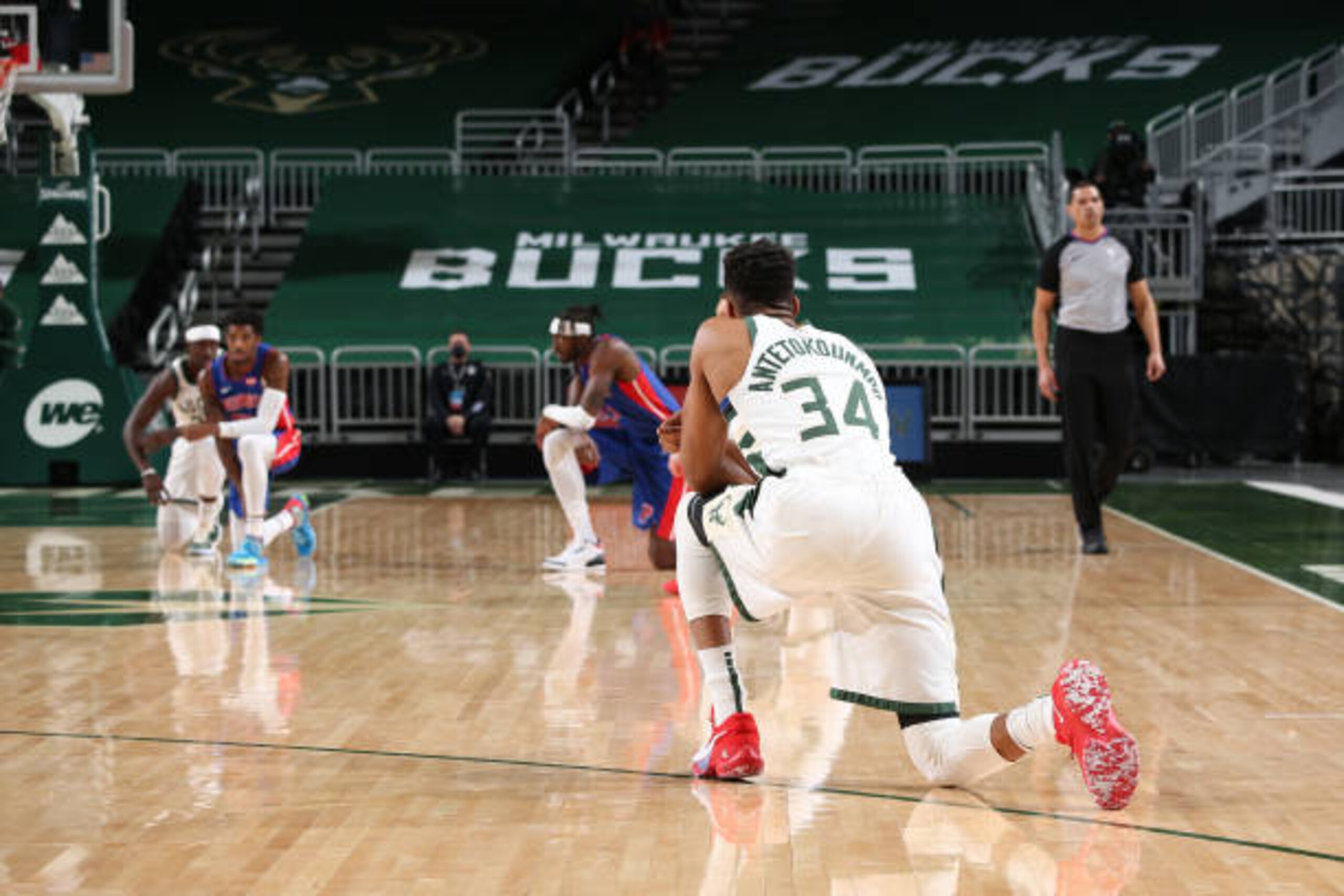 MILWAUKEE, WI - JANUARY 6:  The players kneel during the game on January 6, 2021 at the Fiserv Forum Center in Milwaukee, Wisconsin. NOTE TO USER: User expressly acknowledges and agrees that, by downloading and or using this Photograph, user is consenting to the terms and conditions of the Getty Images License Agreement. Mandatory Copyright Notice: Copyright 2021 NBAE (Photo by Gary Dineen/NBAE via Getty Images).