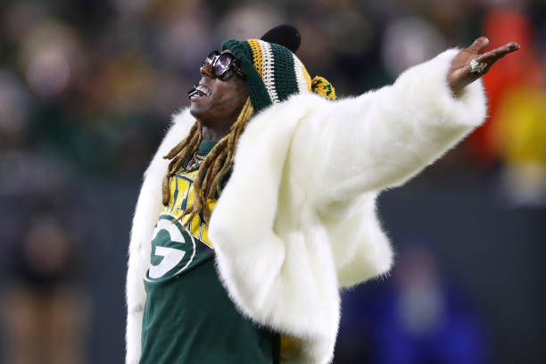 GREEN BAY, WISCONSIN - JANUARY 12: Rapper Lil Wayne performs during the NFC Divisional Playoff game between the Seattle Seahawks and the Green Bay Packers at Lambeau Field on January 12, 2020 in Green Bay, Wisconsin. (Photo by Gregory Shamus/Getty Images)