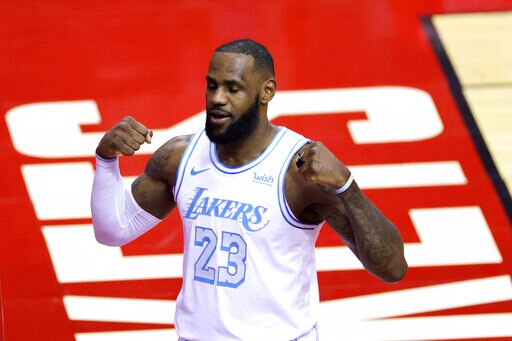 Los Angeles Lakers' LeBron James reacts during the first quarter of an NBA basketball game against the Houston Rockets, Sunday, Jan. 10, 2021, in Houston. (Carmen Mandato/Pool Photo via AP)