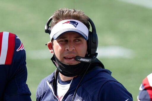 New England Patriots offensive coordinator Josh McDaniels works along the sideline in the first half of an NFL football game against the Miami Dolphins, Sunday, Sept. 13, 2020, in Foxborough, Mass. (AP Photo/Steven Senne)