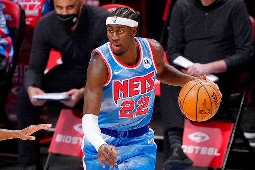 Brooklyn Nets guard Caris LeVert (22) looks for his next move during the first quarter of an NBA basketball gam, Sunday, Jan. 10, 2021, in New York. (AP Photo/Kathy Willens)