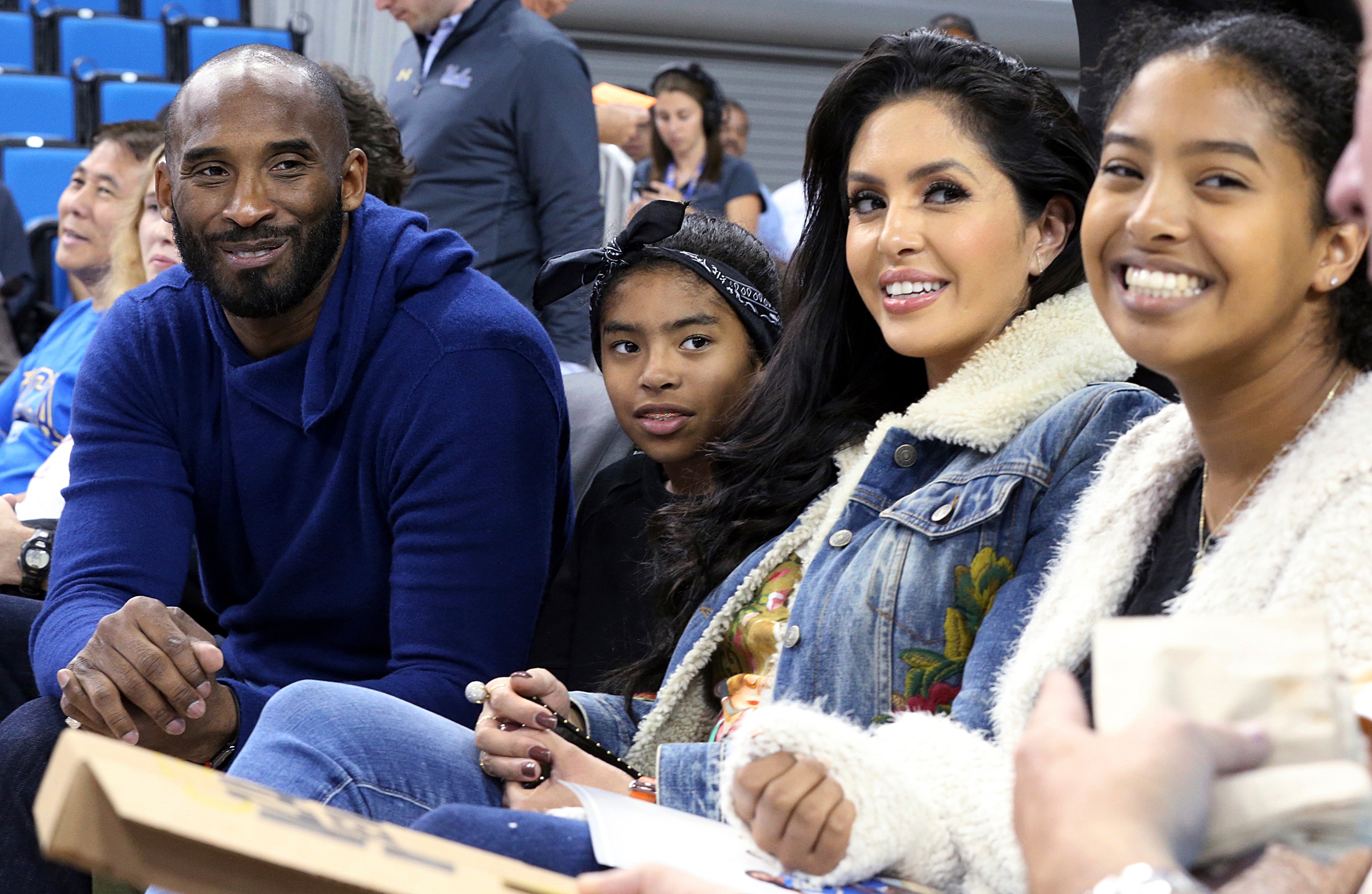 FILE - In this Nov. 21, 2017 file photo, from left, Los Angeles Lakers legend Kobe Bryant, his daughter Gianna Maria-Onore Bryant, wife Vanessa and daughter Natalia Diamante Bryant are seen before a Connecticut-UCLA NCAA women's basketball game in Los Angeles. Kobe Bryant's widow on Monday, Feb. 24, 2020, sued the owner of the helicopter that crashed in fog and killed the former Los Angeles Lakers star and their 13-year-old daughter Gianna last month. The wrongful death lawsuit filed by Vanessa Bryant in Los Angeles Superior Court said the pilot was careless and negligent by flying in cloudy conditions Jan. 26 and should have aborted the flight. (AP Photo/Reed Saxon, File) FILE - In this Nov. 21, 2017 file photo, from left, Los Angeles Lakers legend Kobe Bryant, his daughter Gianna Maria-Onore Bryant, wife Vanessa and daughter Natalia Diamante Bryant are seen before a Connecticut-UCLA NCAA women's basketball game in Los Angeles. Kobe Bryant's widow on Monday, Feb. 24, 2020, sued the owner of the helicopter that crashed in fog and killed the former Los Angeles Lakers star and their 13-year-old daughter Gianna last month. The wrongful death lawsuit filed by Vanessa Bryant in Los Angeles Superior Court said the pilot was careless and negligent by flying in cloudy conditions Jan. 26 and should have aborted the flight. (AP Photo/Reed Saxon, File)