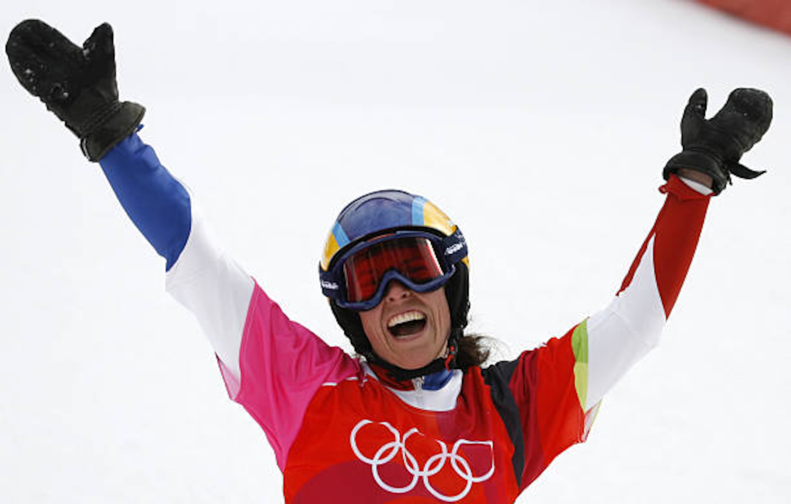 Bardonecchia, ITALY:  Julie Pomagalski from France celebrates 23 February, 2006 following the Turin 2006 Winter Olympics Ladies' Snowboard Parallel Giant Slalom race in Bardonecchia, Italy. Pomagalski placed sixth. AFP PHOTO JEFF HAYNES  (Photo credit should read JEFF HAYNES/AFP via Getty Images)