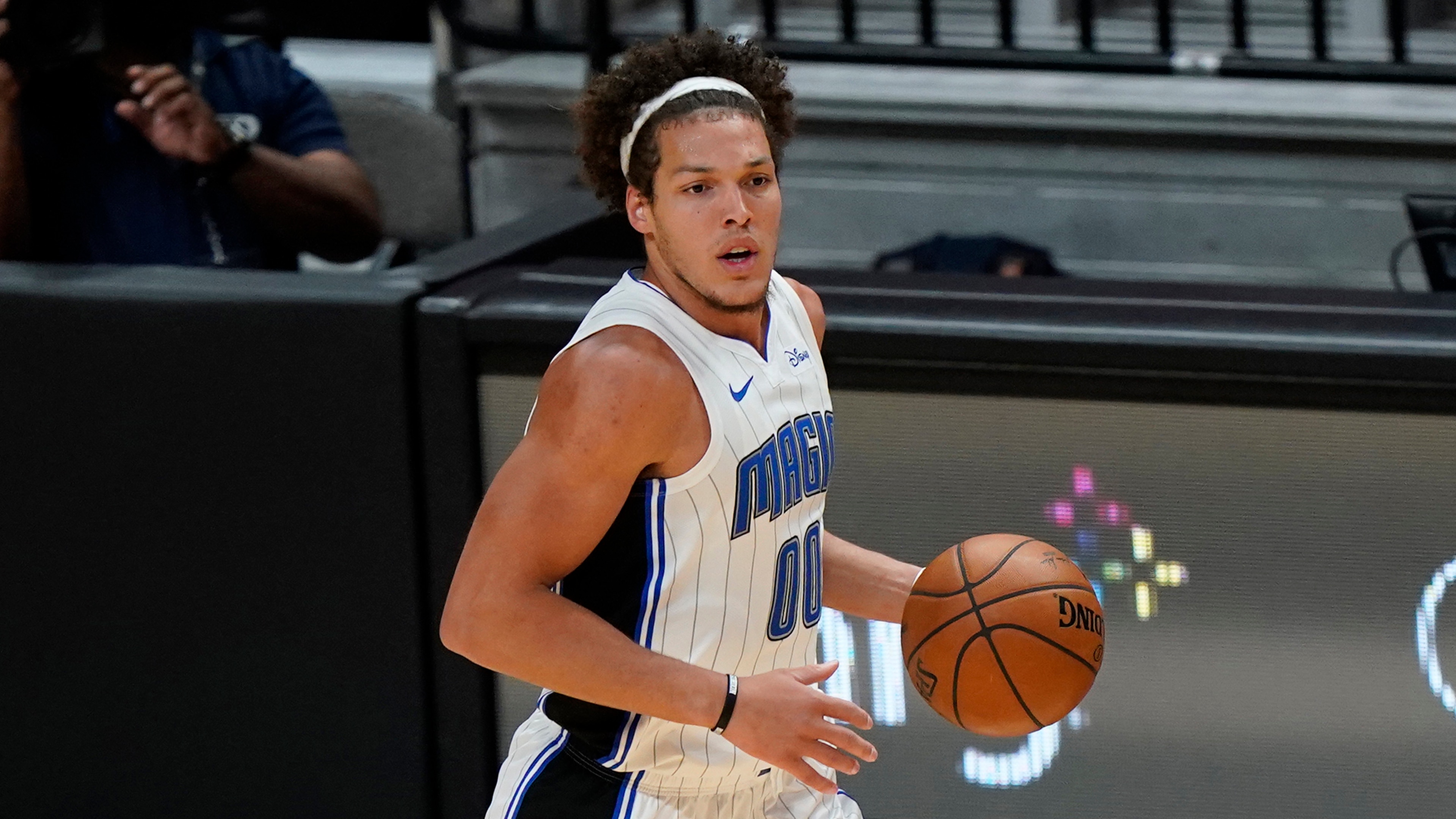 Orlando Magic forward Aaron Gordon takes the ball down court during the second half of an NBA basketball game against the Miami Heat, Thursday, March 11, 2021, in Miami. (AP Photo/Wilfredo Lee)