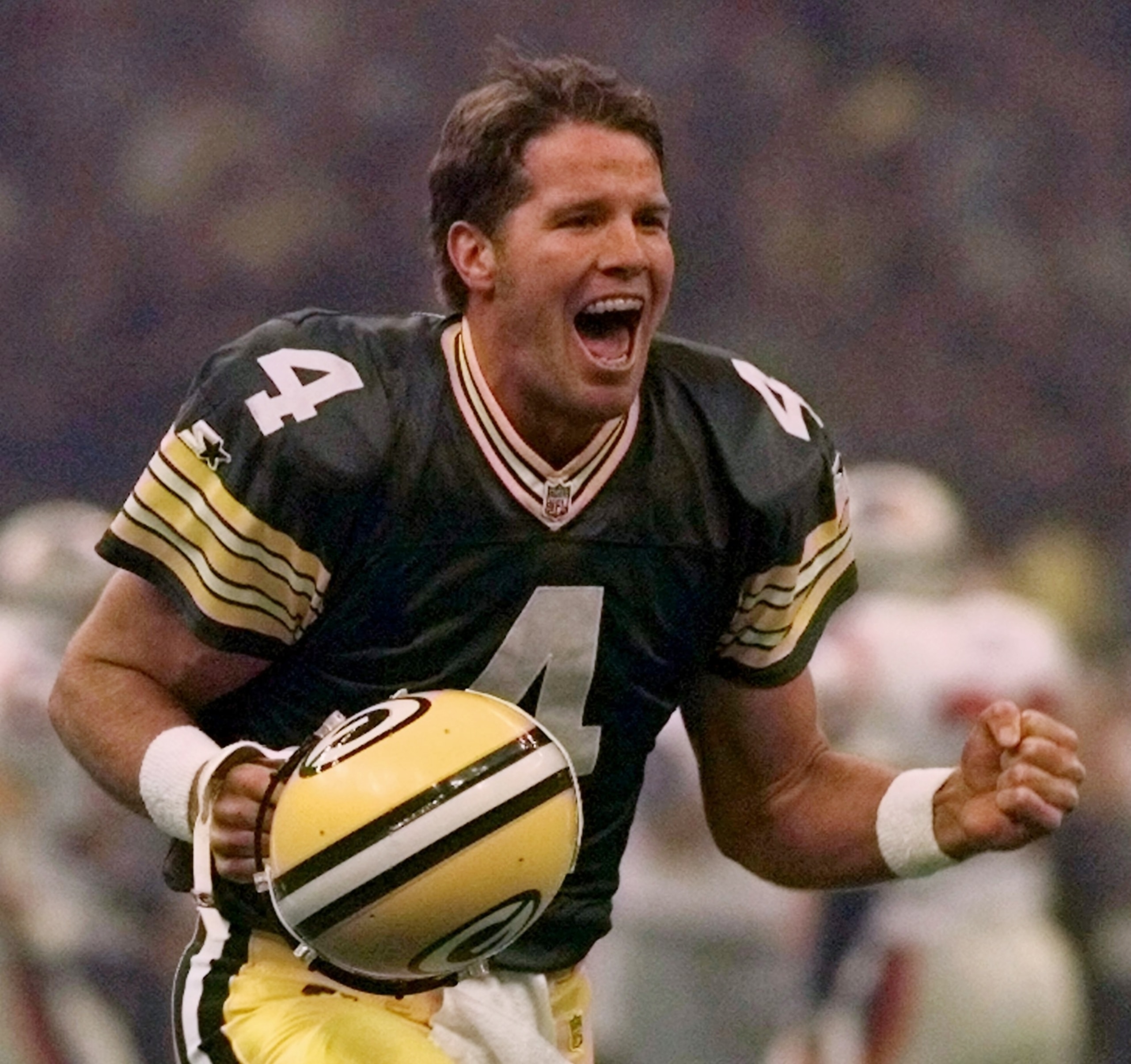 FILE - In this Jan. 26, 1997, file photo, Green Bay Packers quarterback Brett Favre celebrates after throwing a touchdown pass to Andre Rison during the Super Bowl in New Orleans. Favre was equal parts desperado and virtuoso during his 20-year NFL career that was predicated on taking big risks in the game's biggest moments. Favre will be inducted into the Pro Football Hall of Fame on Saturday, Aug. 6, 2016, in Canton, Ohio. (AP Photo/Doug Mills, File) FILE - In this Jan. 26, 1997, file photo, Green Bay Packers quarterback Brett Favre celebrates after throwing a touchdown pass to Andre Rison during the Super Bowl in New Orleans. Favre was equal parts desperado and virtuoso during his 20-year NFL career that was predicated on taking big risks in the game's biggest moments. Favre will be inducted into the Pro Football Hall of Fame on Saturday, Aug. 6, 2016, in Canton, Ohio. (AP Photo/Doug Mills, File)