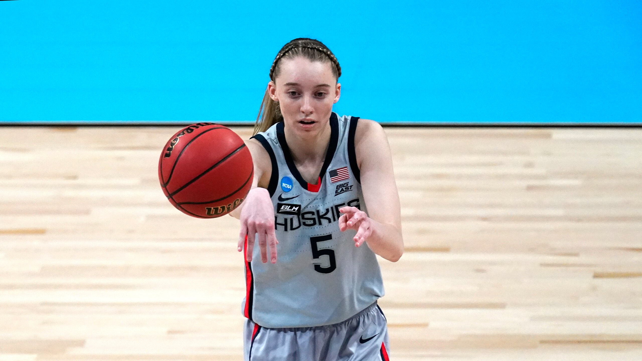 UConn guard Paige Bueckers passes during the first half of a college basketball game against Syracuse in the second round of the women's NCAA tournament at the Alamodome in San Antonio, Tuesday, March 23, 2021. (AP Photo/Charlie Riedel)