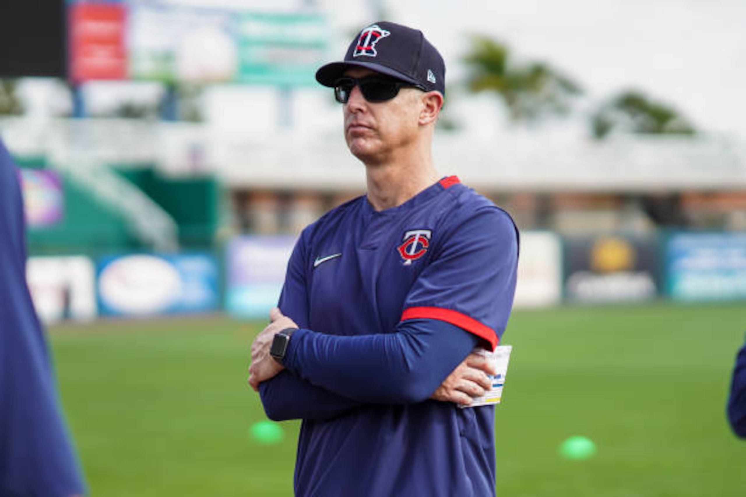 FORT MYERS, FL- FEBRUARY 13: Bench coach Mike Bell #27 of the Minnesota Twins looks on during a team workout on February 13, 2020 at the Hammond Stadium in Fort Myers, Florida. (Photo by Brace Hemmelgarn/Minnesota Twins/Getty Images)