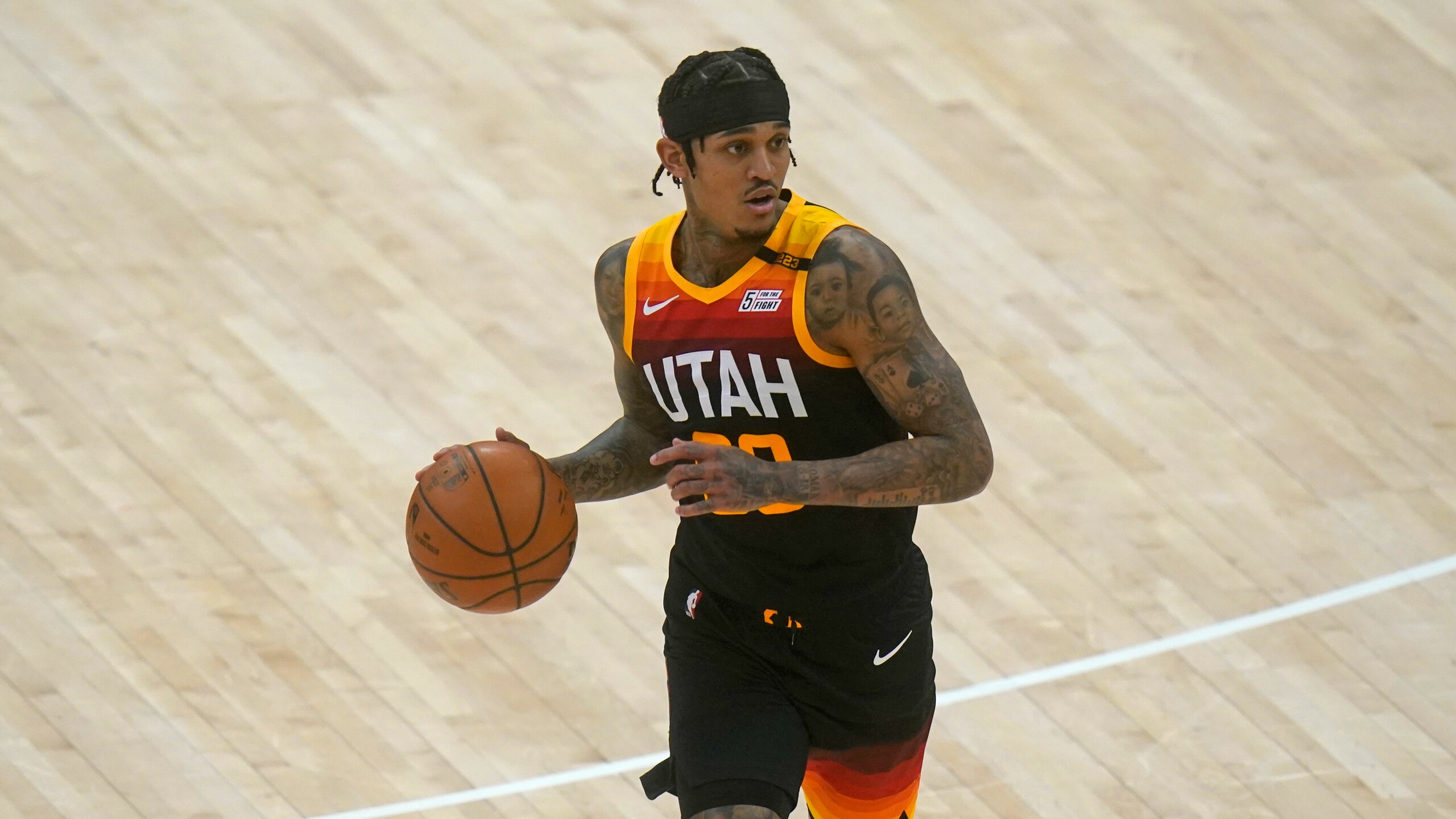 Utah Jazz guard Jordan Clarkson brings the ball up court in the second half during an NBA basketball game against the Cleveland Cavaliers Monday, March 29, 2021, in Salt Lake City. (AP Photo/Rick Bowmer)