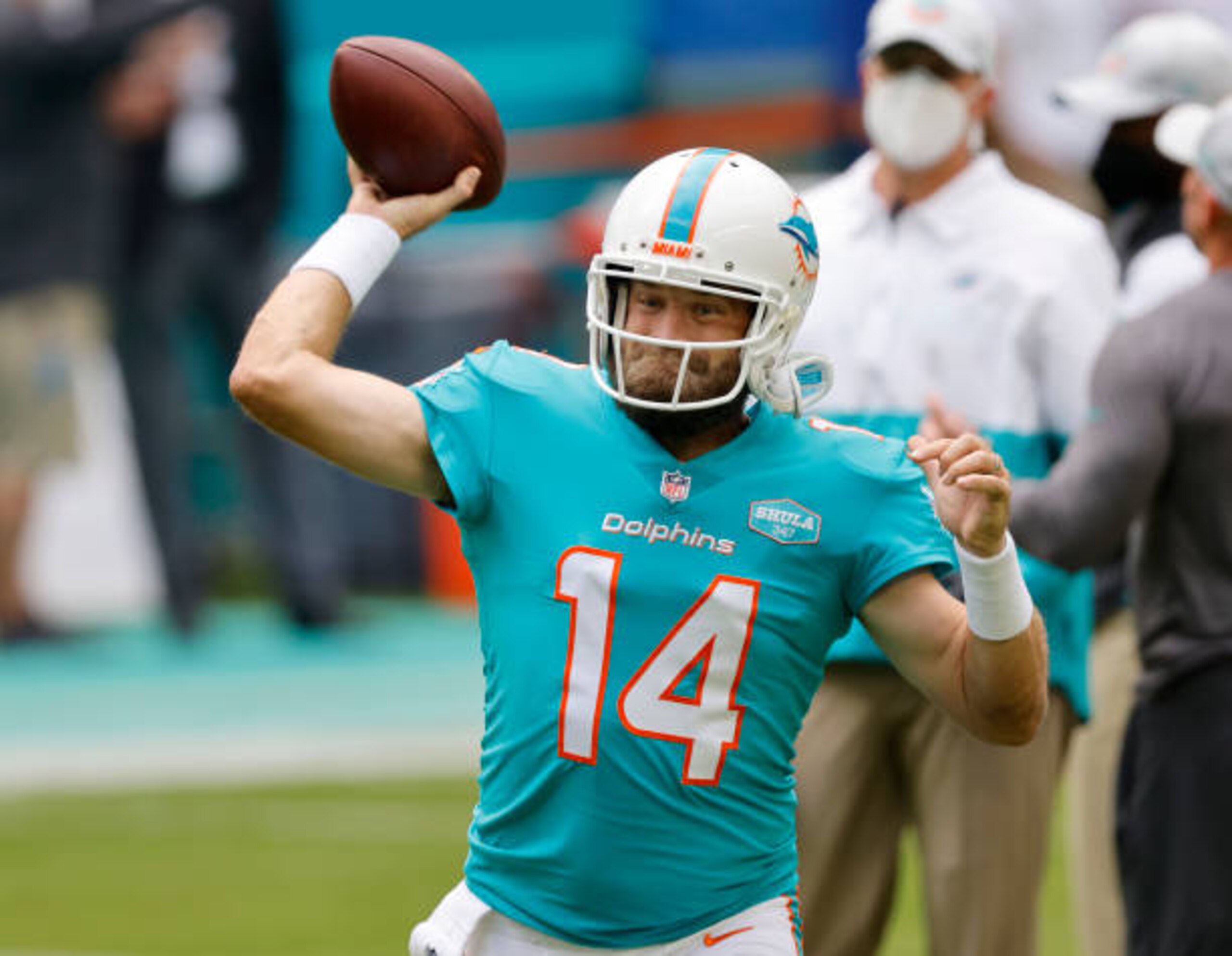 MIAMI GARDENS, FLORIDA - DECEMBER 06: Quarterback Ryan Fitzpatrick #14 of the Miami Dolphins warms prior to the game against the Cincinnati Bengals at Hard Rock Stadium on December 06, 2020 in Miami Gardens, Florida. (Photo by Michael Reaves/Getty Images)