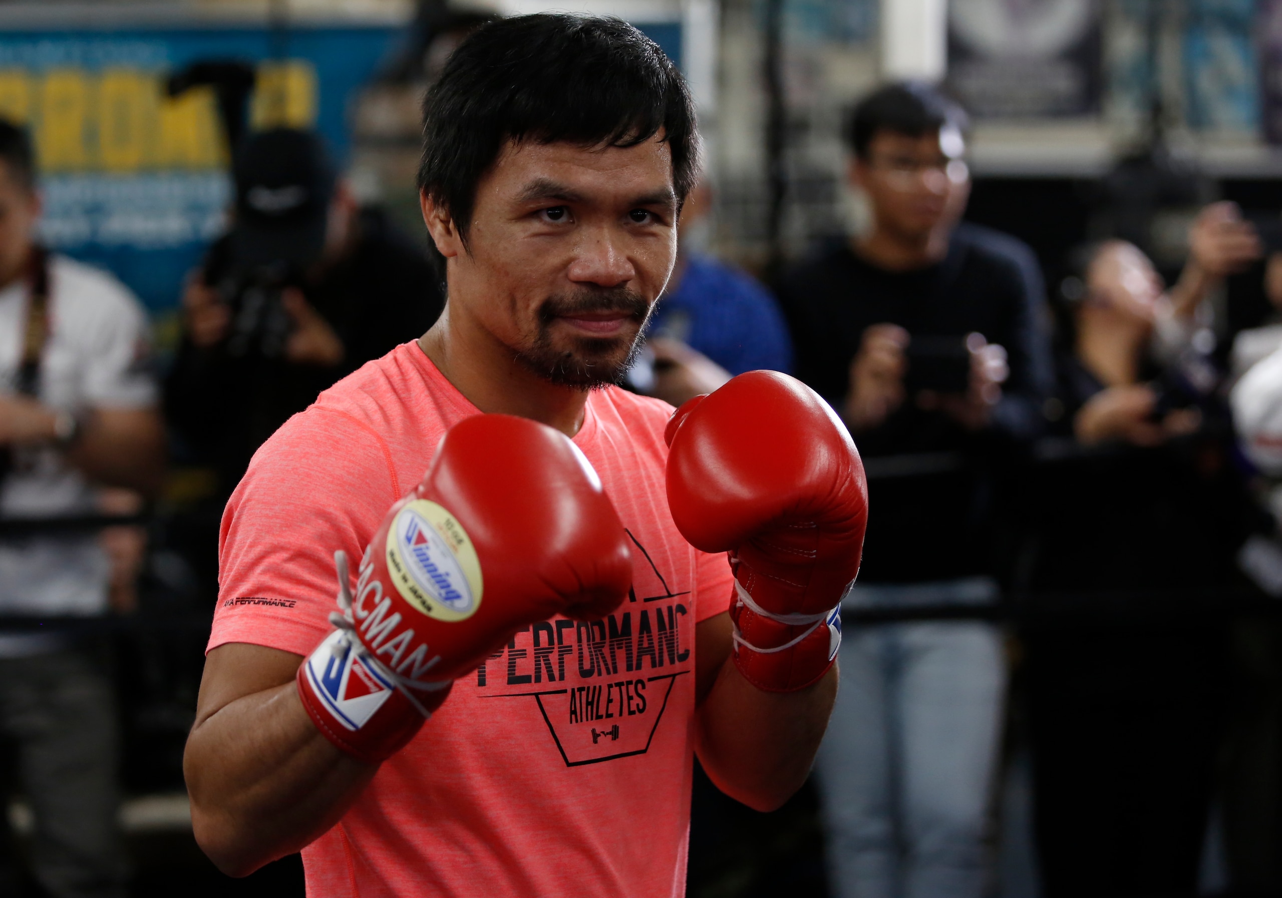Manny Pacquiao, WBA welterweight champion, poses for photos at a boxing club in Los Angeles, Wednesday, Jan. 9, 2019. Pacquiao is scheduled to defend his title against Adrien Broner on Jan. 19 in Las Vegas. (AP Photo/Damian Dovarganes)