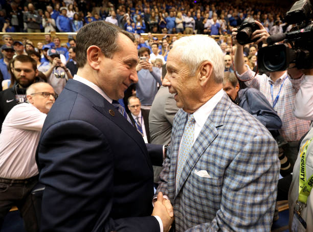 DURHAM, NC - MARCH 03:  (L-R) Head coach Mike Krzyzewski of the Duke Blue Devils talks to head coach Roy Williams of the North Carolina Tar Heels before their game at Cameron Indoor Stadium on March 3, 2018 in Durham, North Carolina.  (Photo by Streeter Lecka/Getty Images)