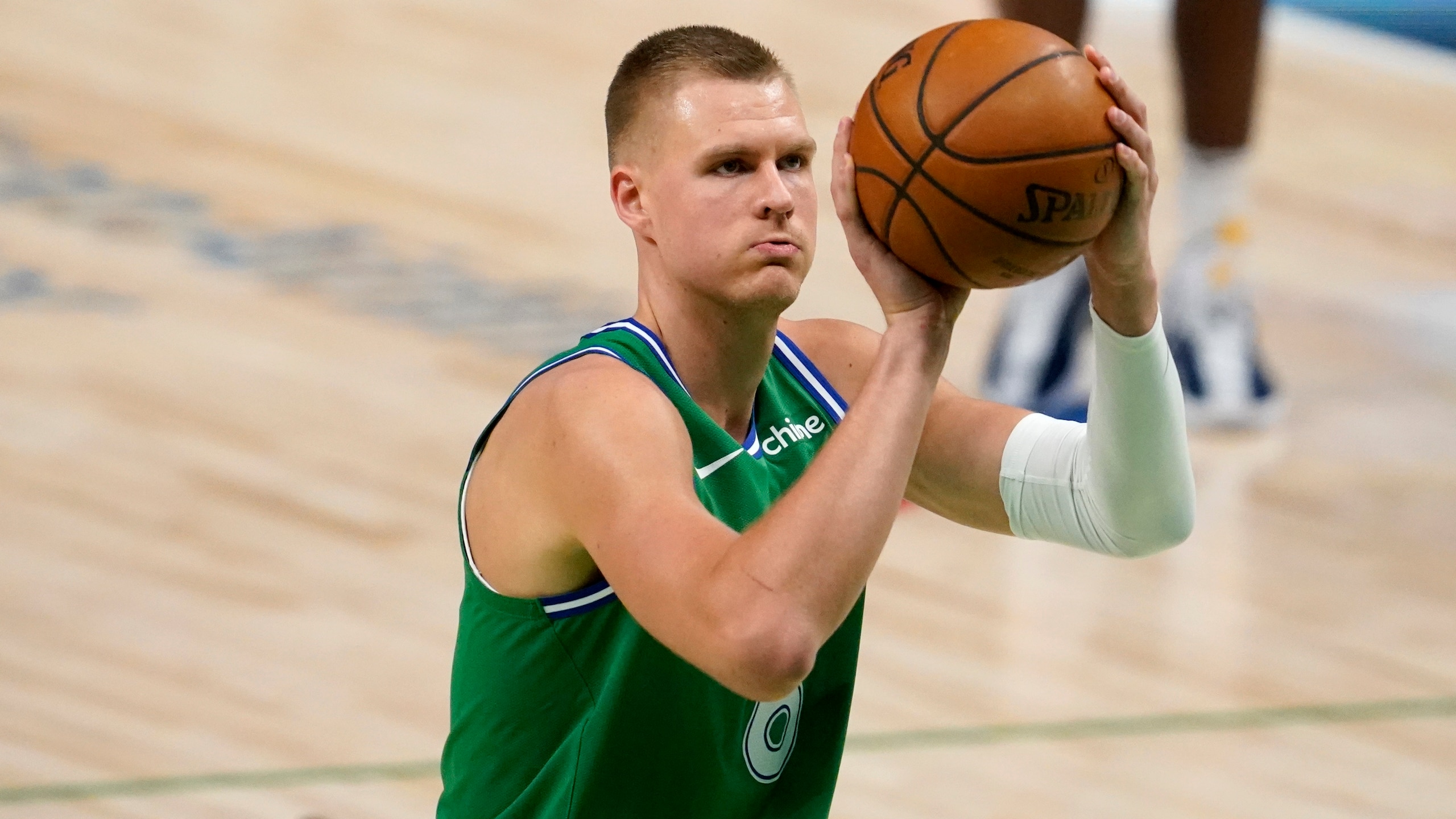 Dallas Mavericks center Kristaps Porzingis shoots free throws during an NBA basketball game against the Indiana Pacers in Dallas, Friday, March 26, 2021. (AP Photo/Tony Gutierrez)
