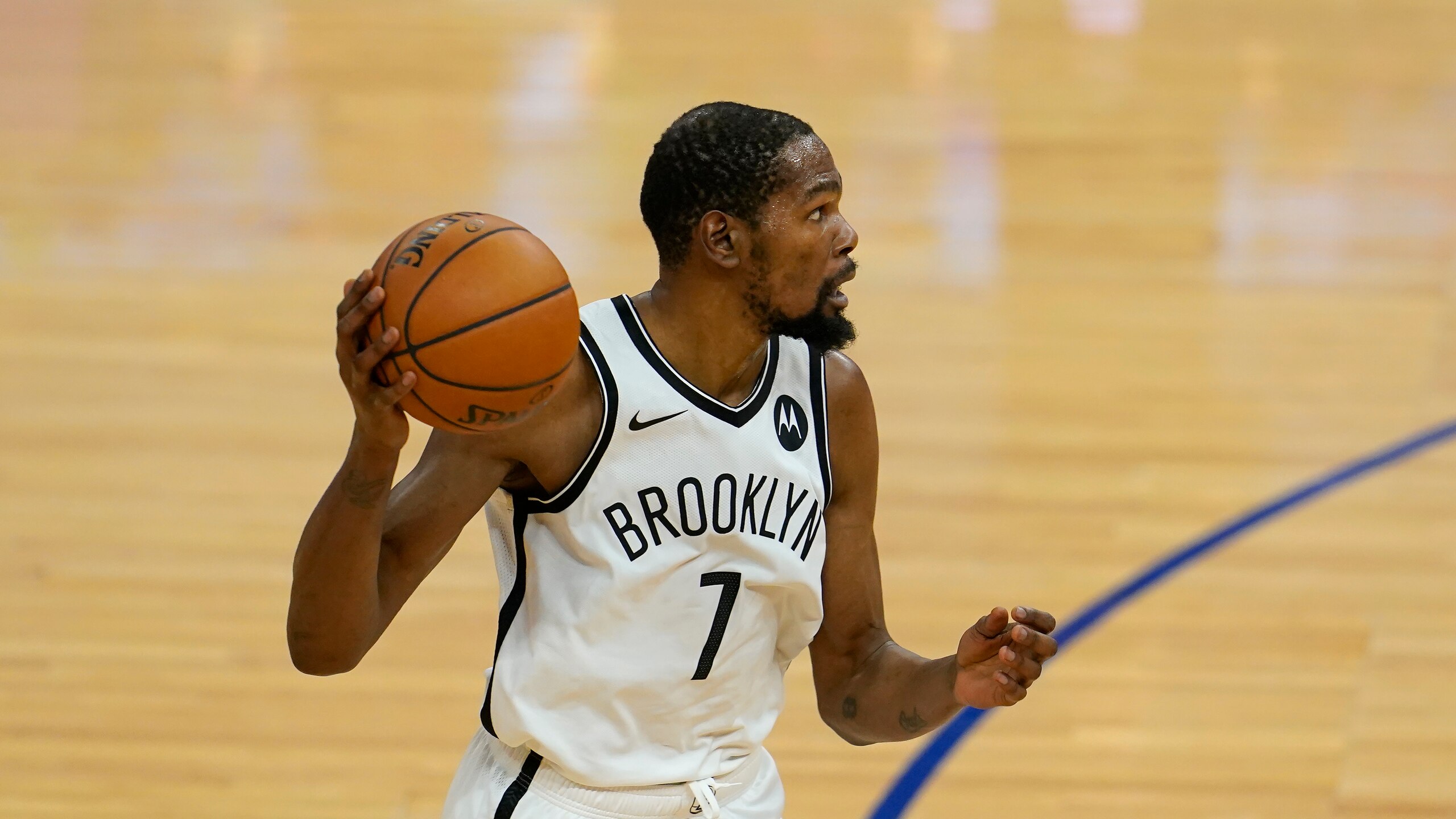 Brooklyn Nets forward Kevin Durant (7) against the Golden State Warriors during an NBA basketball game in San Francisco, Saturday, Feb. 13, 2021. (AP Photo/Jeff Chiu)