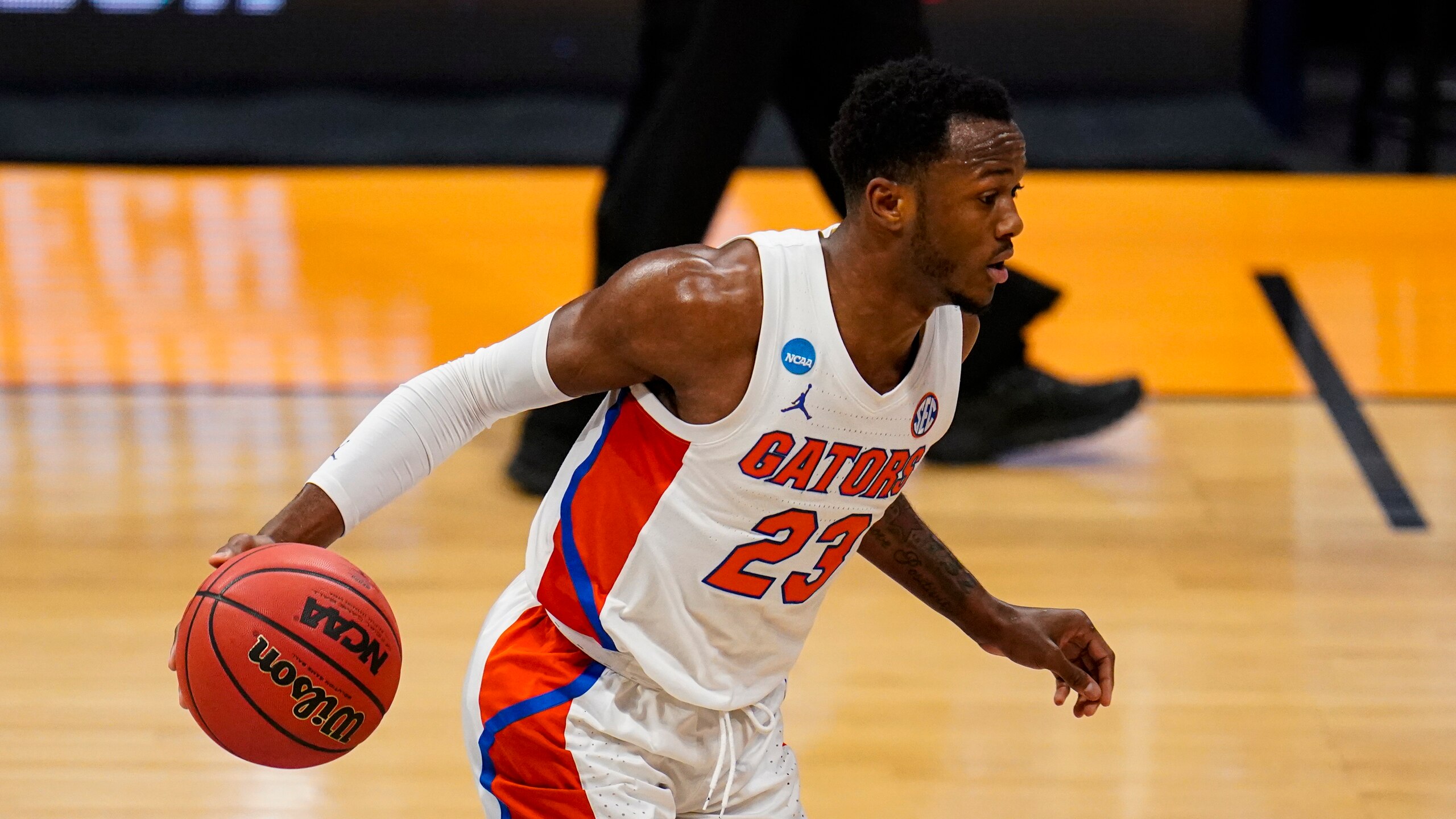 Florida guard Scottie Lewis (23) plays against Virginia Tech in the first half of a first round game in the NCAA men's college basketball tournament at Hinkle Fieldhouse in Indianapolis, Friday, March 19, 2021. (AP Photo/Michael Conroy)