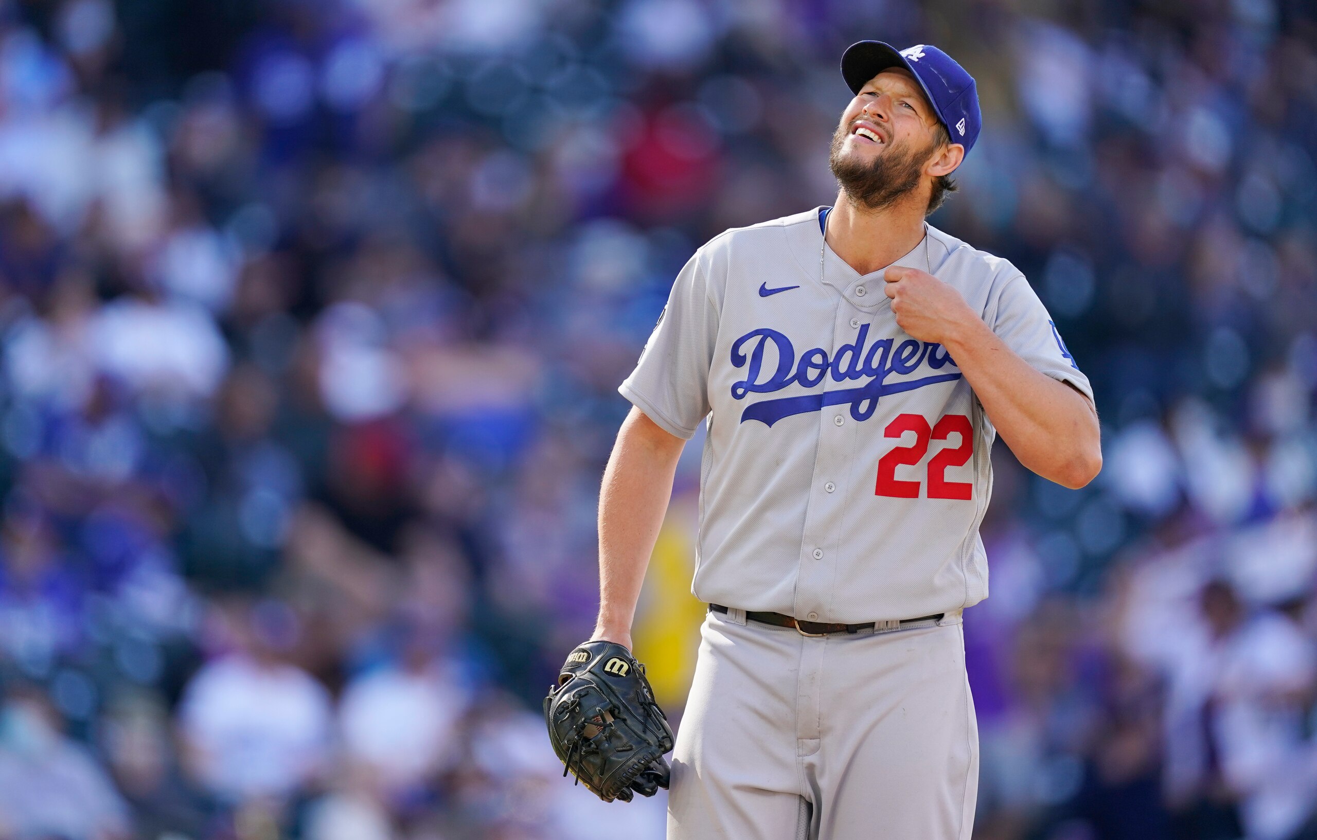 Los Angeles Dodgers starting pitcher Clayton Kershaw waits to be pulled from the mound after giving up an RBI-single to Colorado Rockies' Raimel Tapia in the sixth inning of a baseball game Thursday, April 1, 2021, in Denver. (AP Photo/David Zalubowski)
