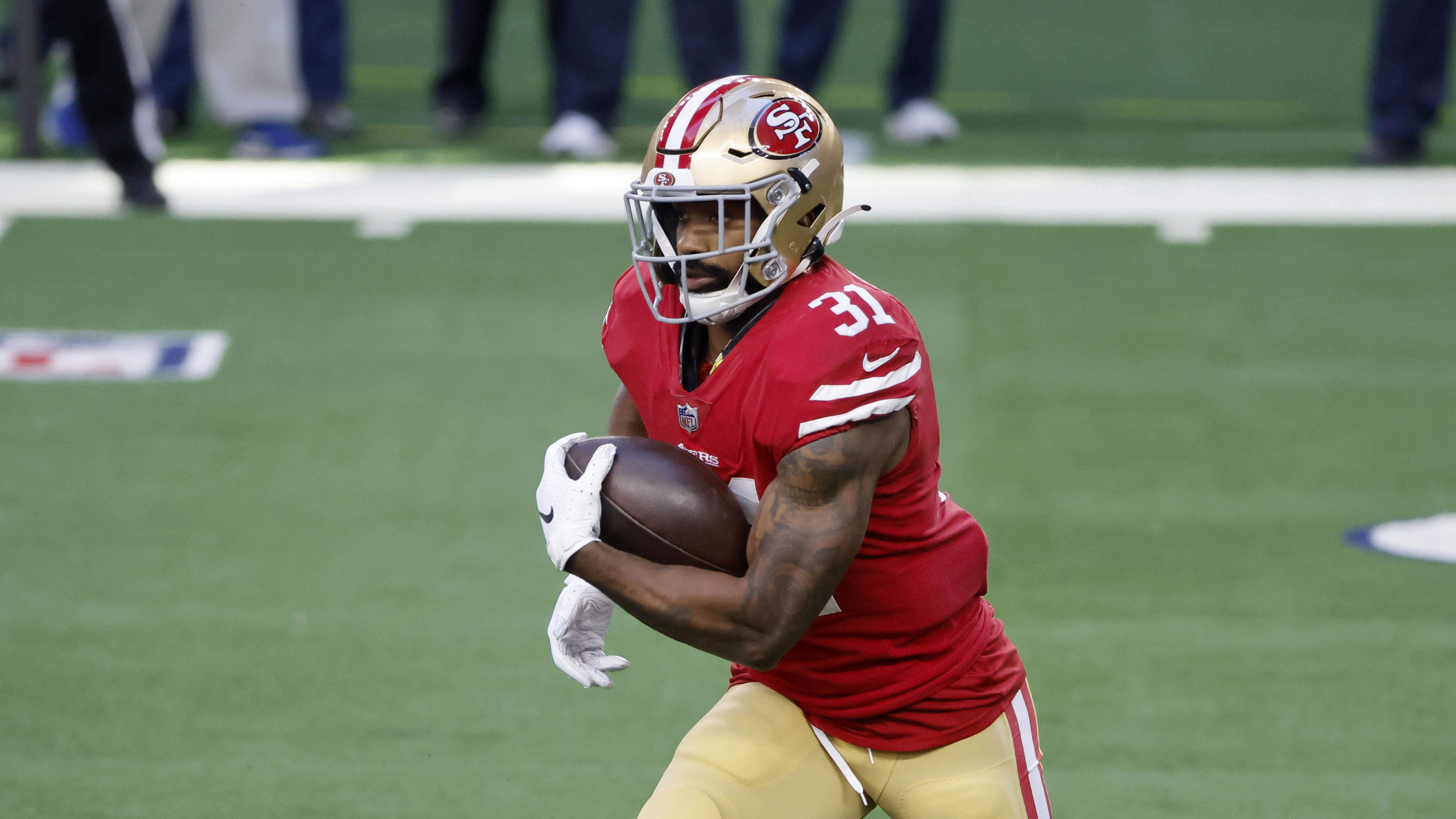 San Francisco 49ers running back Raheem Mostert (31) runs the ball during an NFL football game in Arlington, Texas, Sunday, Dec. 20, 2020. (AP Photo/Michael Ainsworth)