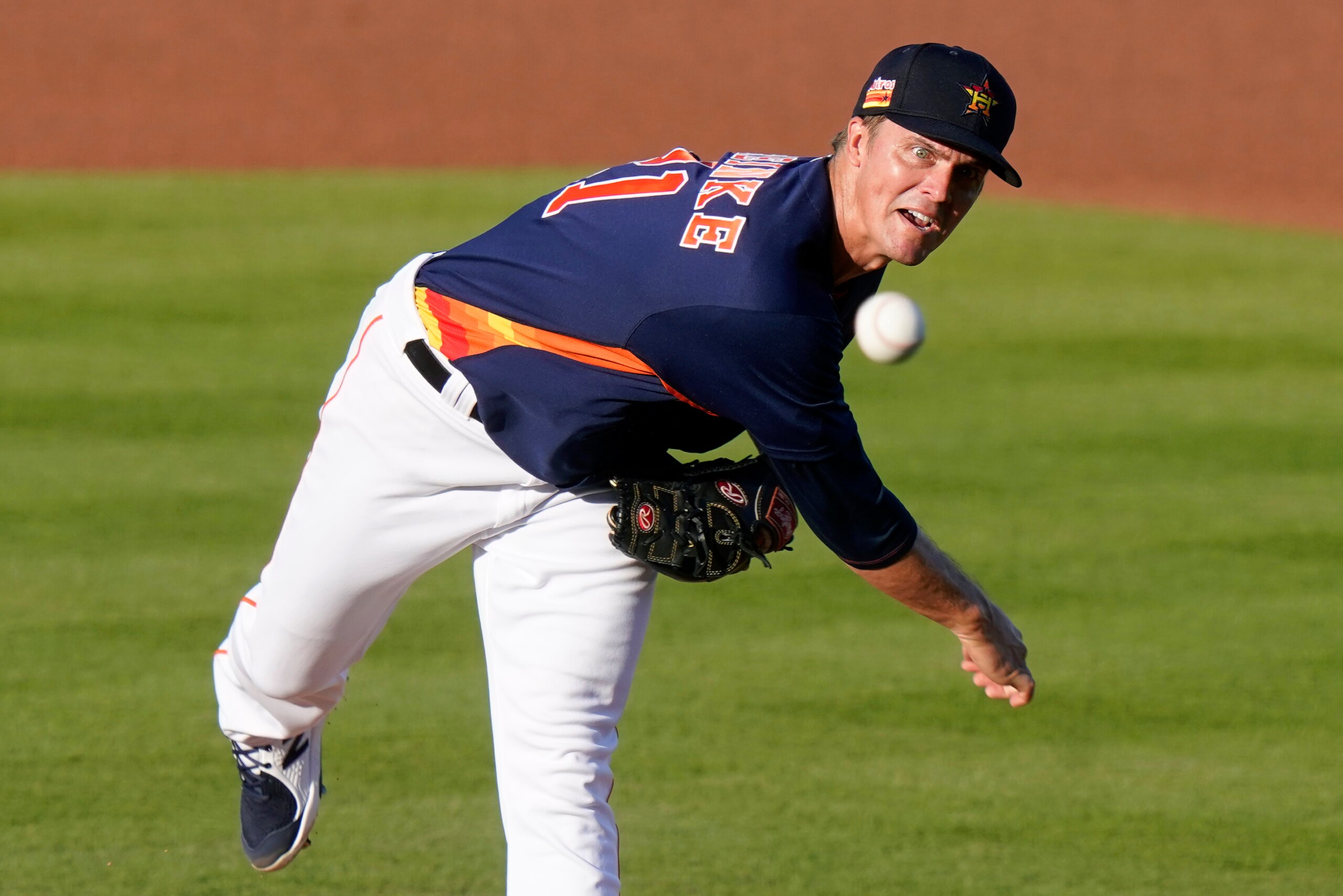 Houston Astros starting pitcher Zack Greinke throws during the first inning of the team's spring training baseball game against the Miami Marlins, Friday, March 26, 2021, in West Palm Beach, Fla. (AP Photo/Lynne Sladky)