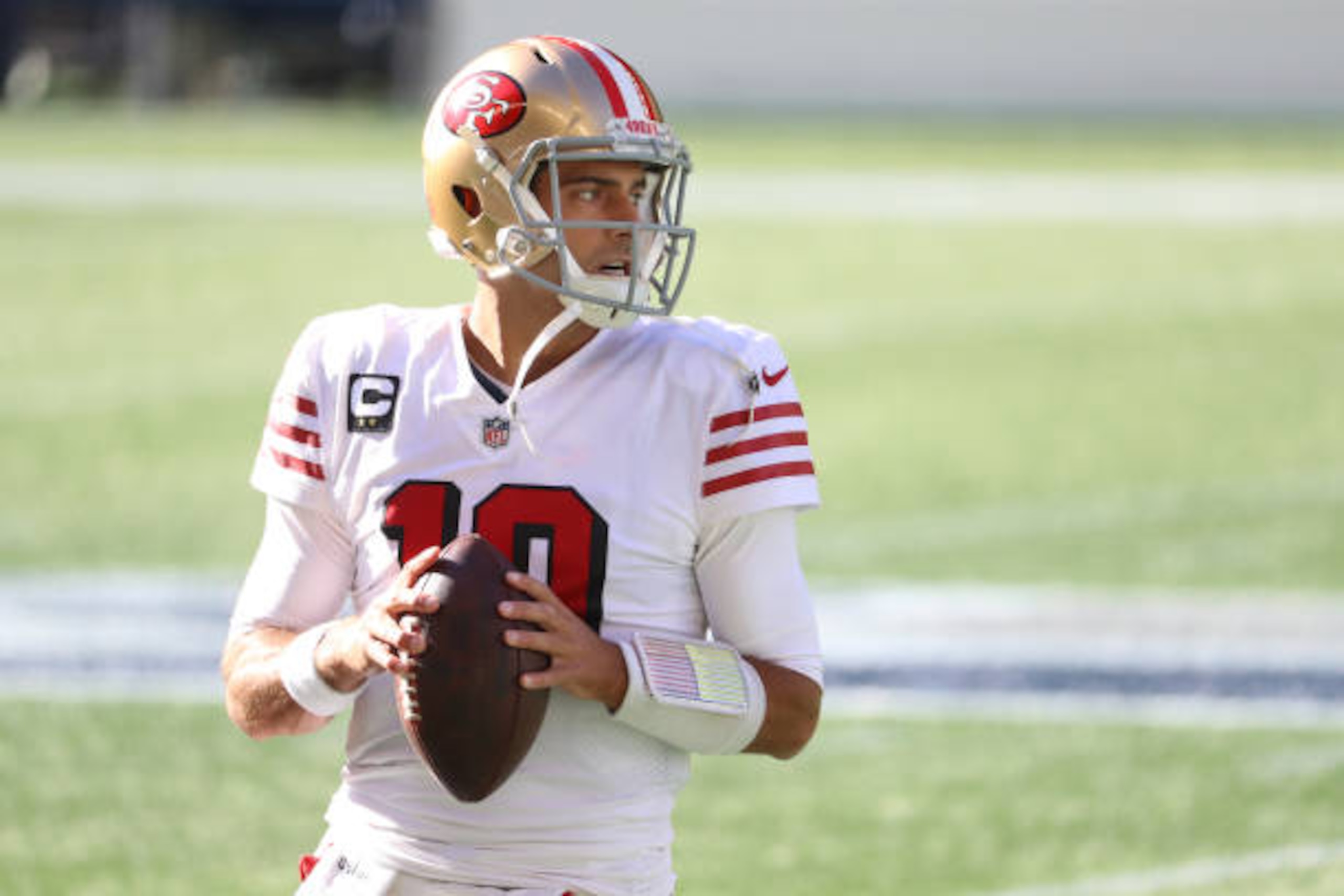 SEATTLE, WASHINGTON - NOVEMBER 01: Quarterback Jimmy Garoppolo #10 of the San Francisco 49ers looks to pass during warmups before playing the Seattle Seahawks at CenturyLink Field on November 01, 2020 in Seattle, Washington. (Photo by Abbie Parr/Getty Images)