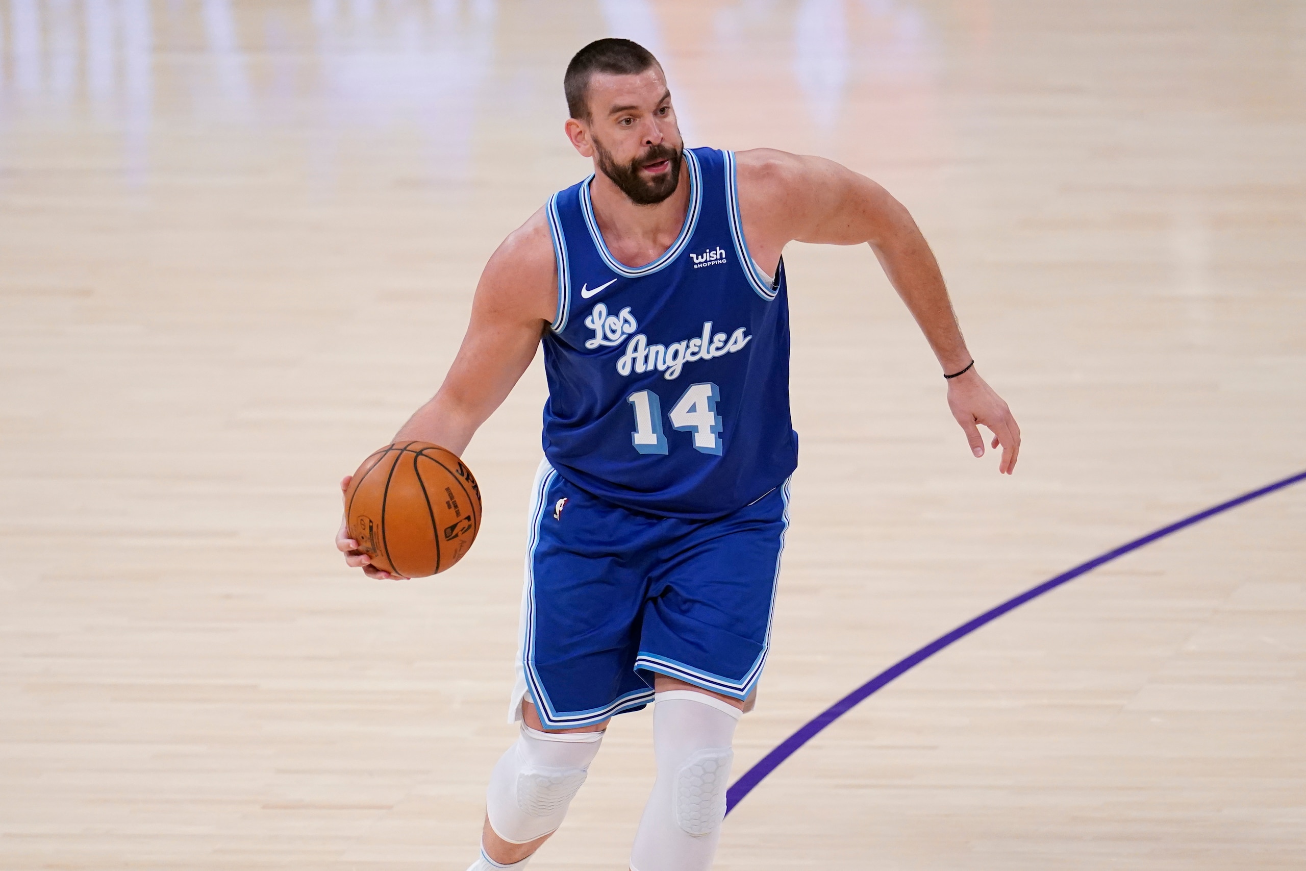 Los Angeles Lakers center Marc Gasol (14) dribbles against the Brooklyn Nets during the second half of an NBA basketball game Thursday, Feb. 18, 2021, in Los Angeles. (AP Photo/Marcio Jose Sanchez)