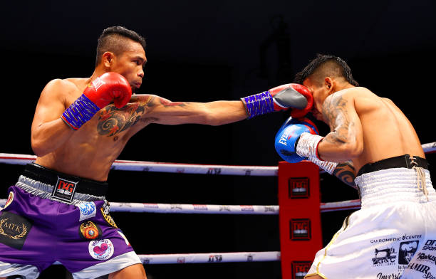 DUBAI, UNITED ARAB EMIRATES - APRIL 03: Donnie Nietes of the Philippines (L) punches Pablo Carrillo of Colombia during the WBO International Super-Flyweight Title Fight between Donnie Nietes and Pablo Carrillo at The Rotunda at Caesars Palace on April 03, 2021 in Dubai, United Arab Emirates. (Photo by Francois Nel/Getty Images)