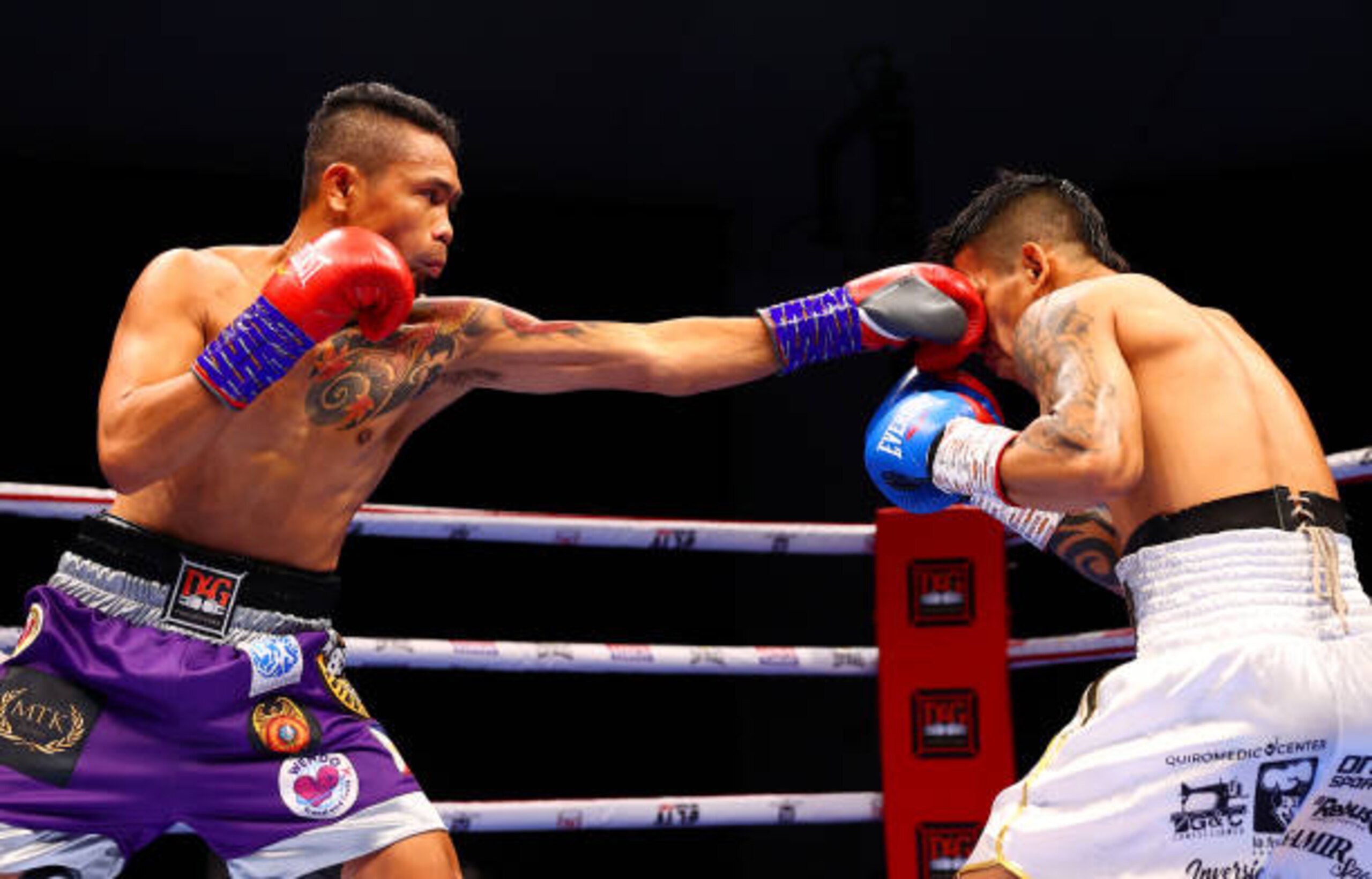 DUBAI, UNITED ARAB EMIRATES - APRIL 03: Donnie Nietes of the Philippines (L) punches Pablo Carrillo of Colombia during the WBO International Super-Flyweight Title Fight between Donnie Nietes and Pablo Carrillo at The Rotunda at Caesars Palace on April 03, 2021 in Dubai, United Arab Emirates. (Photo by Francois Nel/Getty Images)