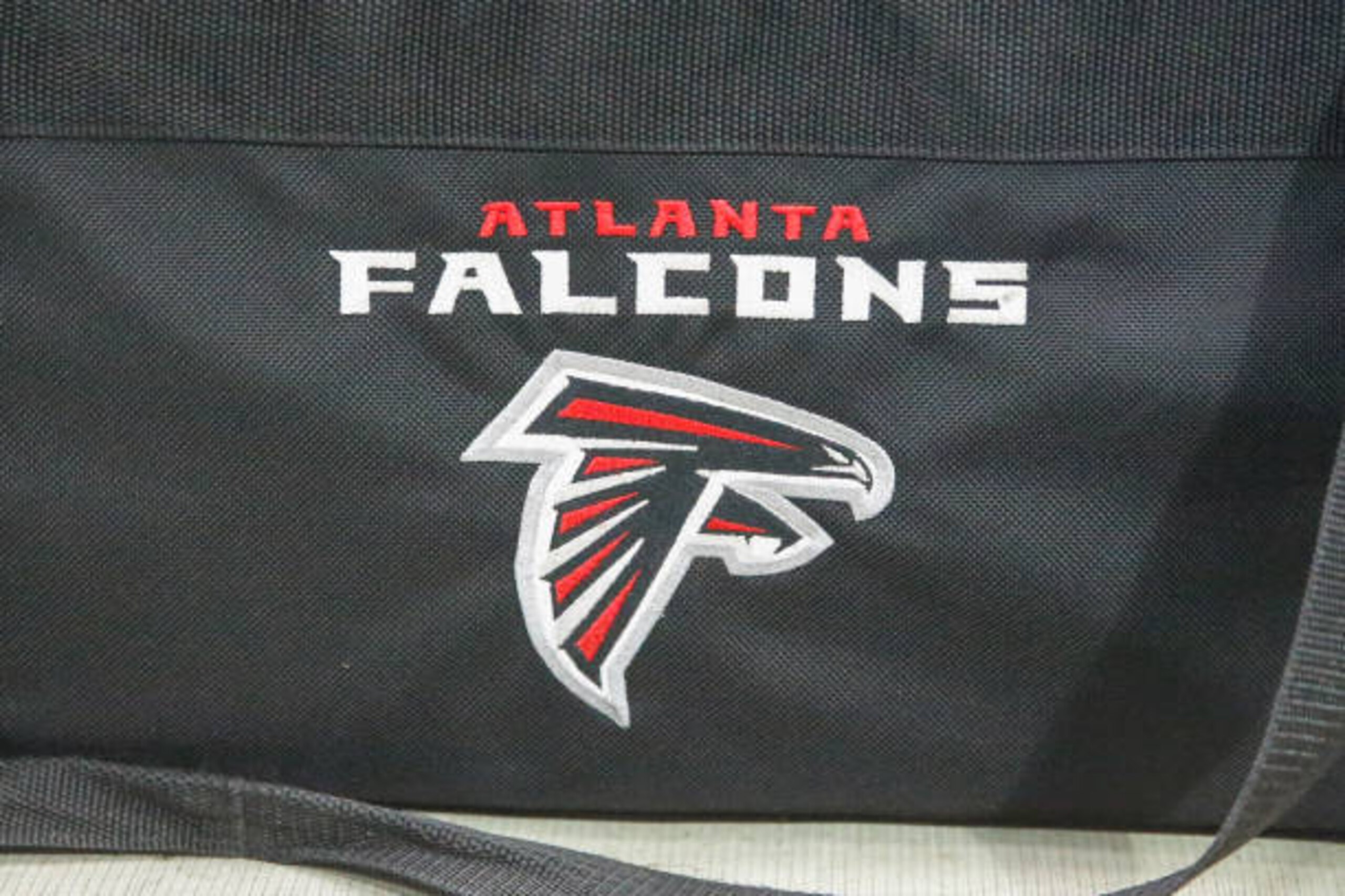 GLENDALE, AZ - OCTOBER 13: The Atlanta Falcons logo on a bag during the NFL football game between the Atlanta Falcons and the Arizona Cardinals on October 13, 2019 at State Farm Stadium in Glendale, Arizona. (Photo by Kevin Abele/Icon Sportswire via Getty Images) GLENDALE, AZ - OCTOBER 13: The Atlanta Falcons logo on a bag during the NFL football game between the Atlanta Falcons and the Arizona Cardinals on October 13, 2019 at State Farm Stadium in Glendale, Arizona. (Photo by Kevin Abele/Icon Sportswire via Getty Images)