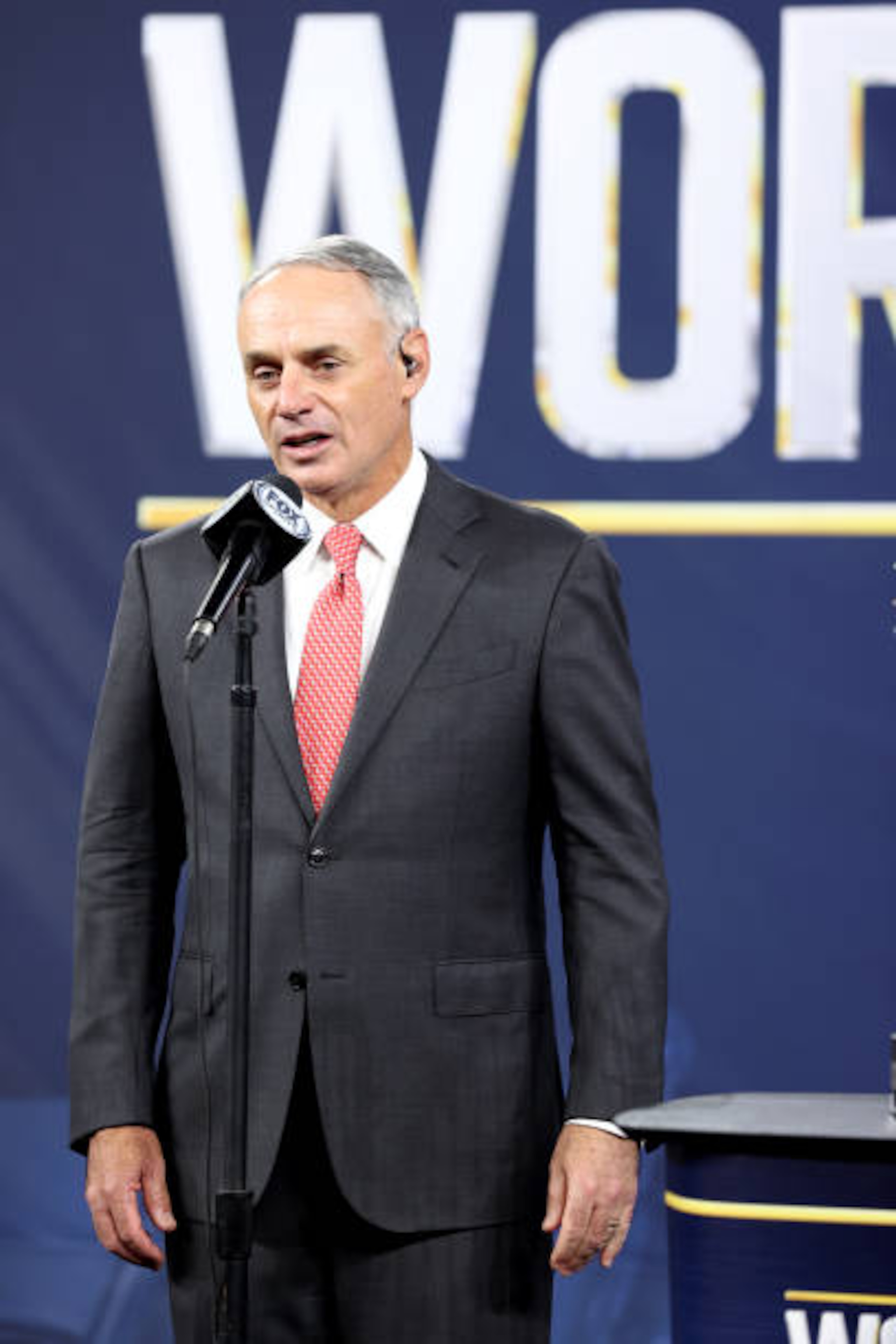 ARLINGTON, TX - OCTOBER 27:  Major League Baseball Commissioner Robert D. Manfred Jr. presents the Commissioners Trophy to Los Angeles Dodgers Owner Mark Walter after the Dodgers defeated the Tampa Bay Rays in Game 6 to clinch the 2020 World Series at Globe Life Field on Tuesday, October 27, 2020 in Arlington, Texas. (Photo by Alex Trautwig/MLB Photos via Getty Images)