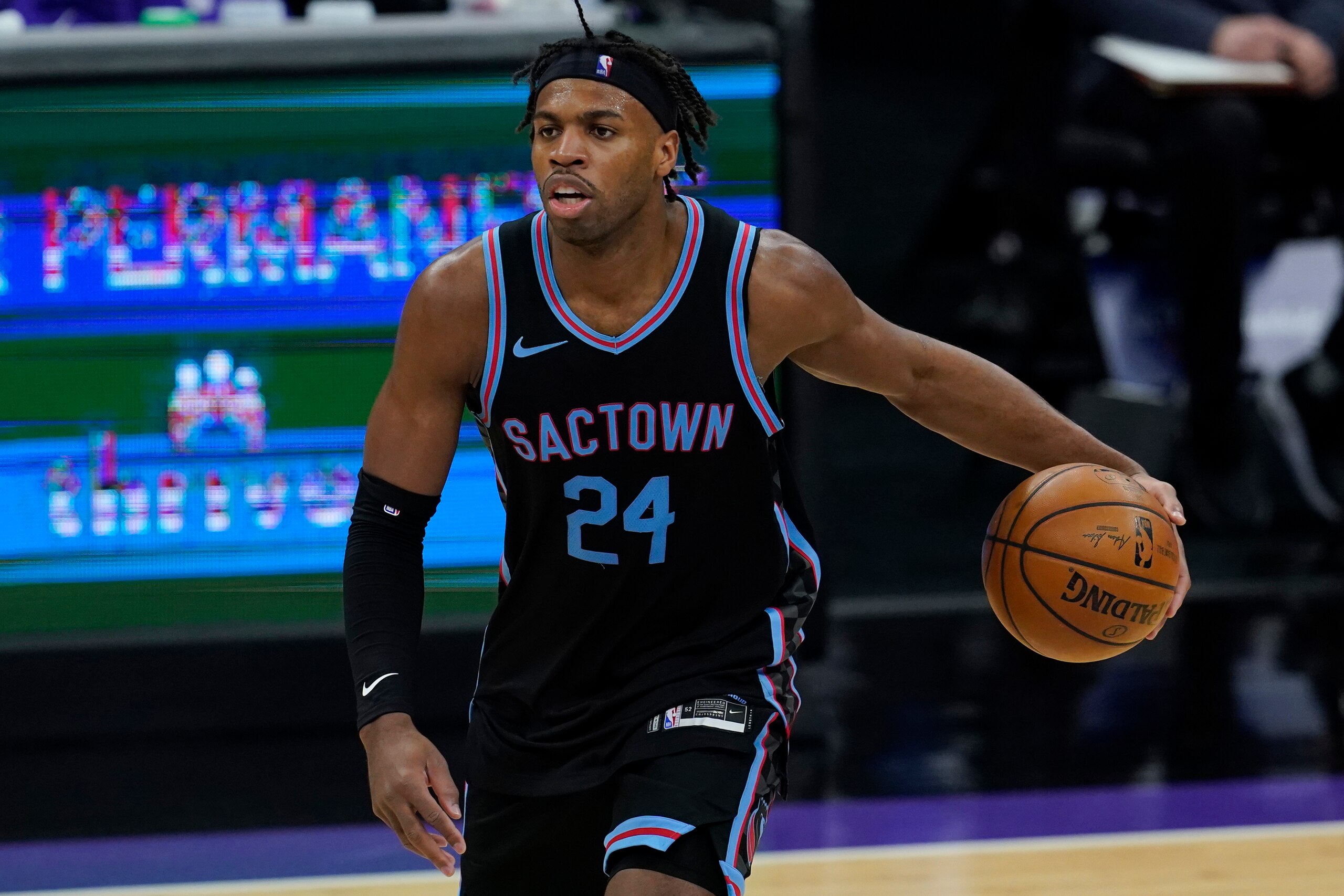 Sacramento Kings guard Buddy Hield (24) against the Cleveland Cavaliers during an NBA basketball game in Sacramento, Calif., Saturday, March 27, 2021. (AP Photo/Jeff Chiu)