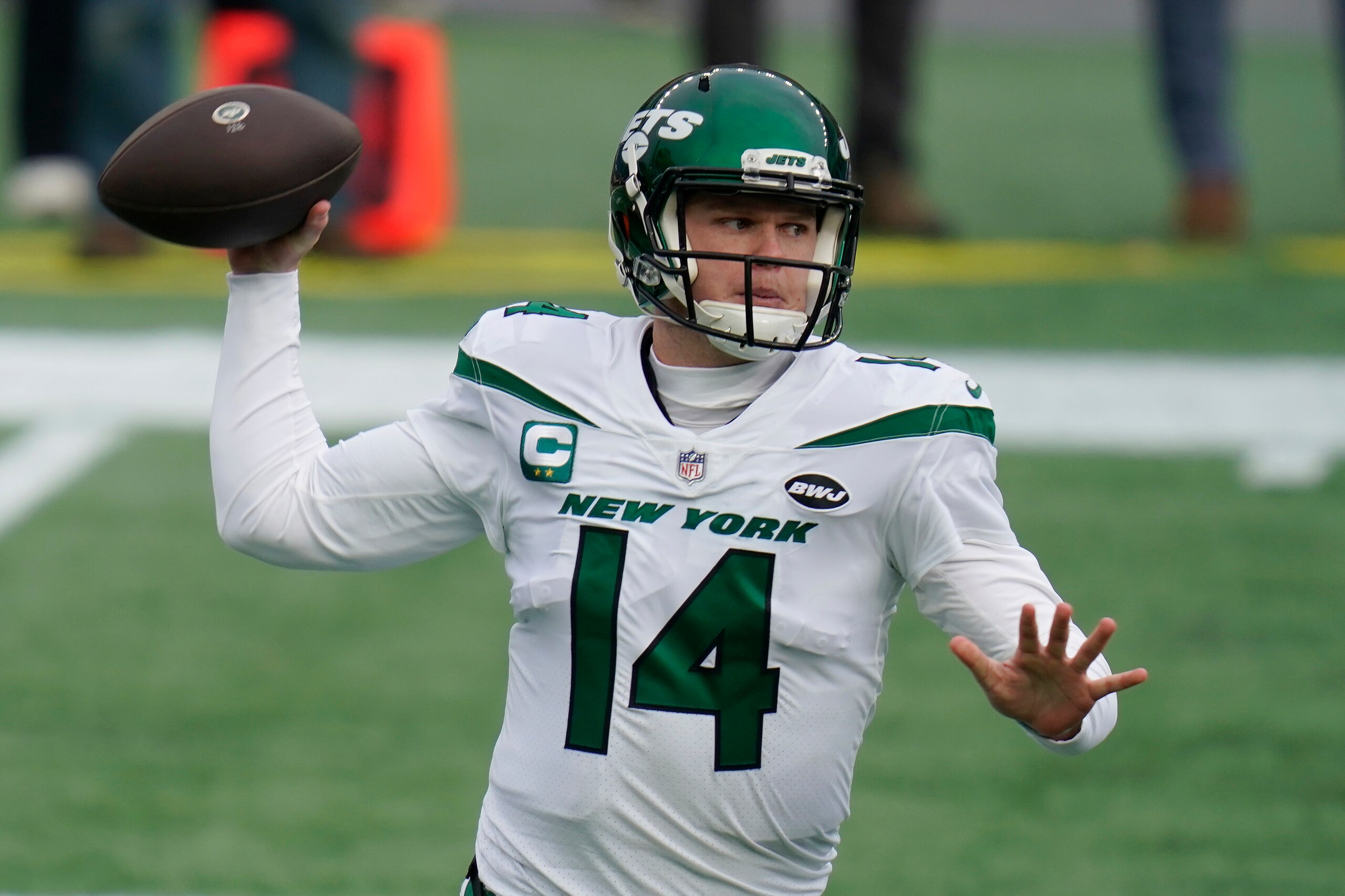 New York Jets quarterback Sam Darnold rolls out to pass against the New England Patriots in the first half of an NFL football game, Sunday, Jan. 3, 2021, in Foxborough, Mass. (AP Photo/Charles Krupa) New York Jets quarterback Sam Darnold rolls out to pass against the New England Patriots in the first half of an NFL football game, Sunday, Jan. 3, 2021, in Foxborough, Mass. (AP Photo/Charles Krupa)