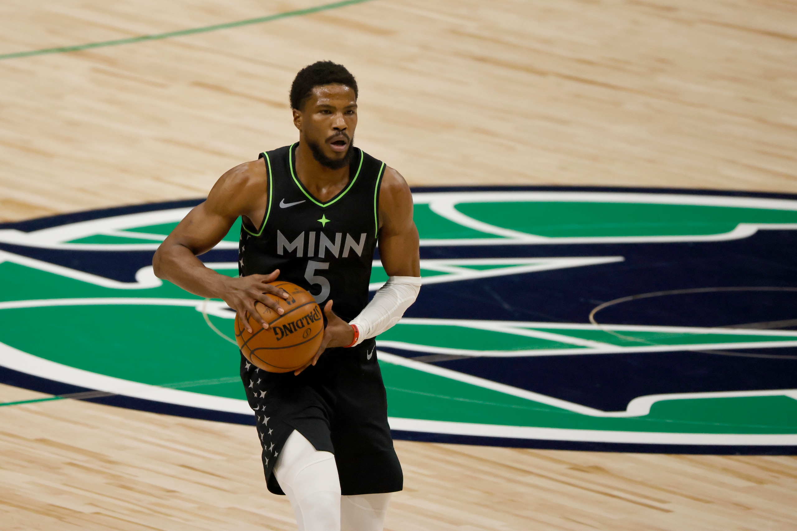 Minnesota Timberwolves guard Malik Beasley (5) handles the ball against the Dallas Mavericks during the second half of an NBA basketball game, Monday, Feb. 8, 2021, in Dallas. (AP Photo/Ron Jenkins) Minnesota Timberwolves guard Malik Beasley (5) handles the ball against the Dallas Mavericks during the second half of an NBA basketball game, Monday, Feb. 8, 2021, in Dallas. (AP Photo/Ron Jenkins)