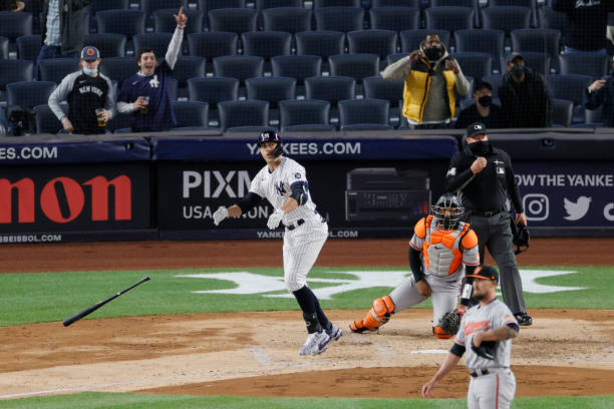 NEW YORK, NEW YORK - APRIL 05: Giancarlo Stanton #27 of the New York Yankees drops his bat as the crowd reacts to his grand slam hit during the fifth inning against the Baltimore Orioles at Yankee Stadium on April 05, 2021 in the Bronx borough of New York City. (Photo by Sarah Stier/Getty Images) NEW YORK, NEW YORK - APRIL 05: Giancarlo Stanton #27 of the New York Yankees drops his bat as the crowd reacts to his grand slam hit during the fifth inning against the Baltimore Orioles at Yankee Stadium on April 05, 2021 in the Bronx borough of New York City. (Photo by Sarah Stier/Getty Images)