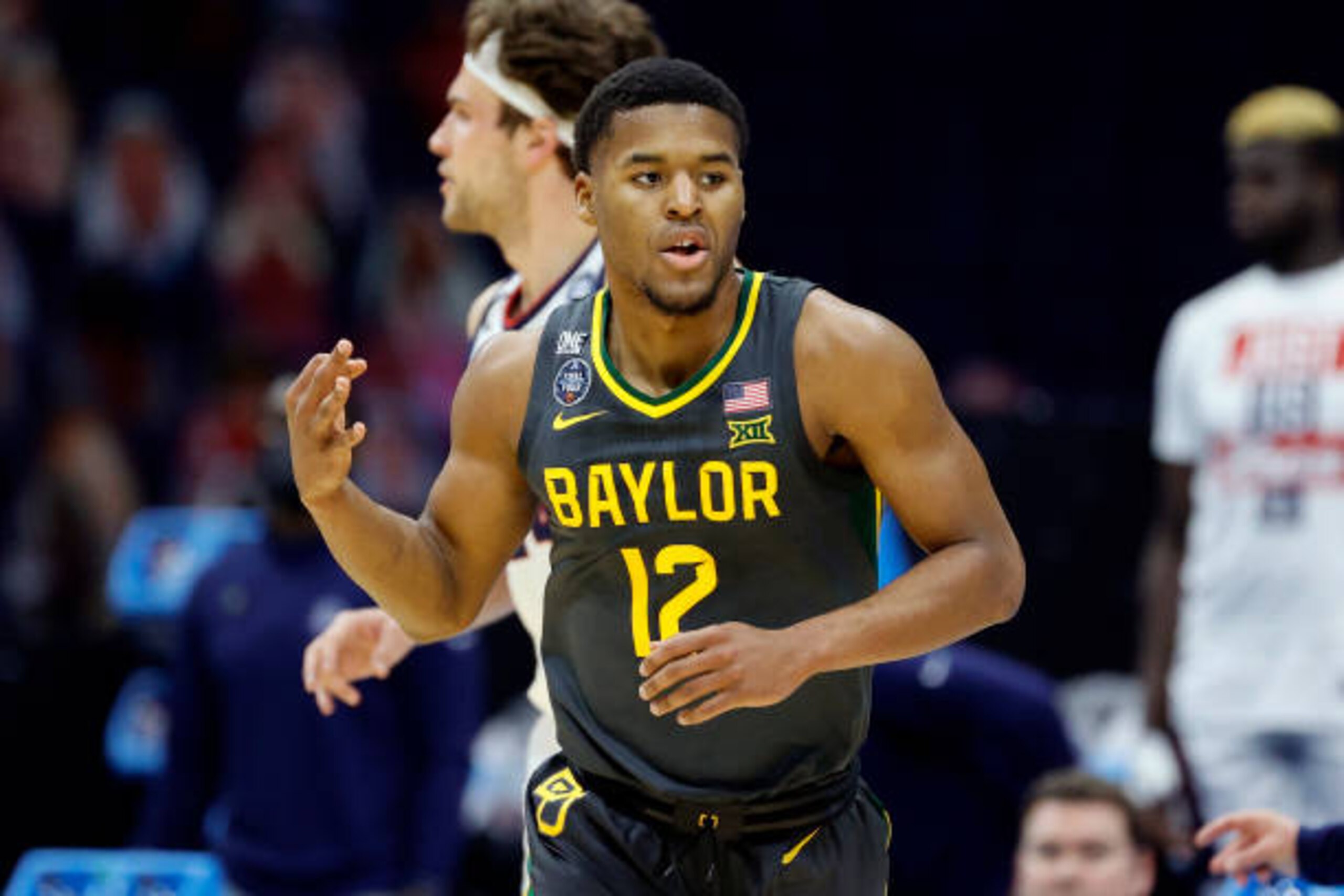 INDIANAPOLIS, INDIANA - APRIL 05: Jared Butler #12 of the Baylor Bears reacts after a basket in the first half against the Gonzaga Bulldogs during the first half in the National Championship game against the Gonzaga Bulldogs of the 2021 NCAA Men's Basketball Tournament at Lucas Oil Stadium on April 05, 2021 in Indianapolis, Indiana. (Photo by Tim Nwachukwu/Getty Images)