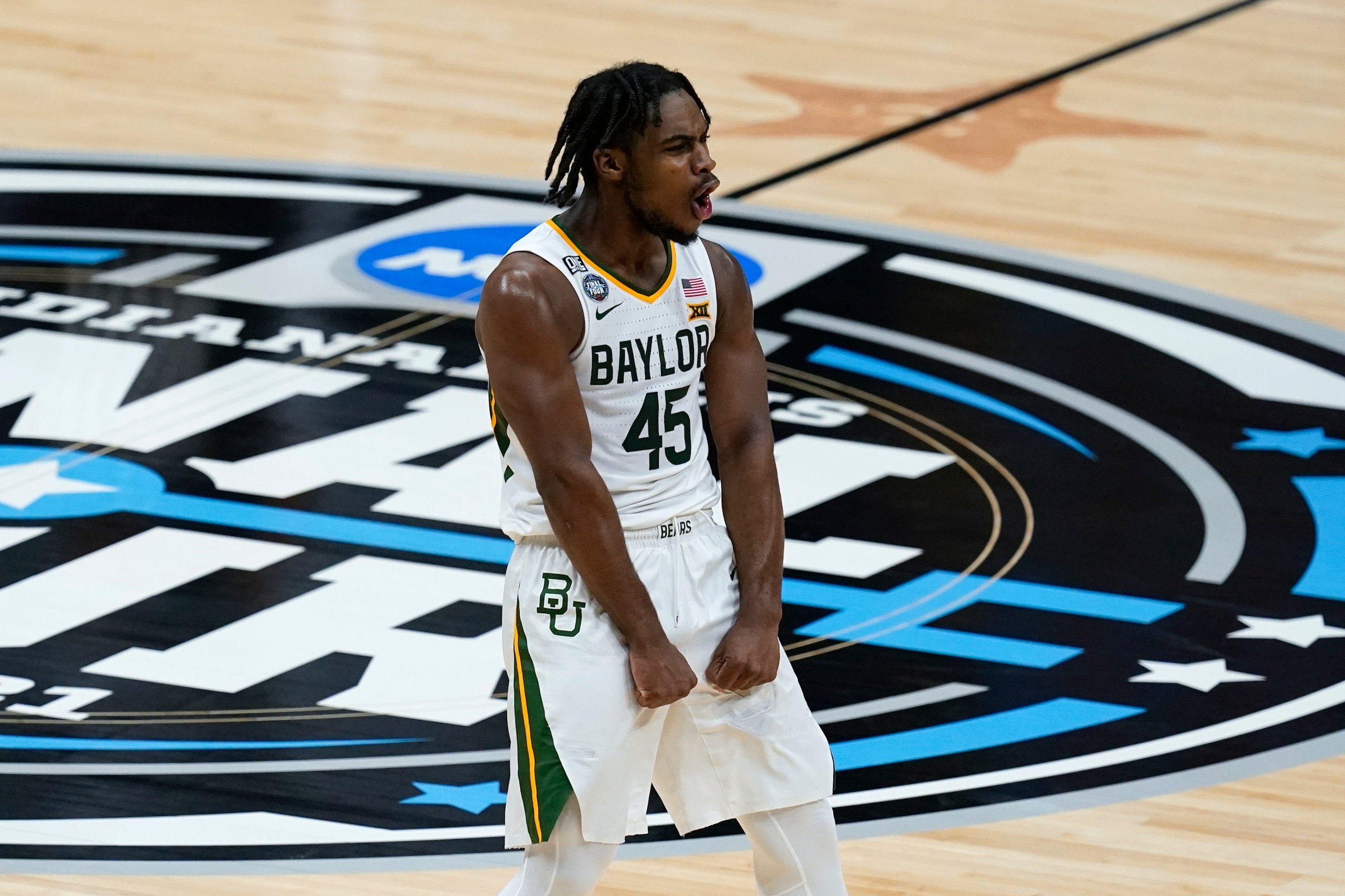 Baylor guard Davion Mitchell (45) celebrates during the first half of a men's Final Four NCAA college basketball tournament semifinal game against Houston, Saturday, April 3, 2021, at Lucas Oil Stadium in Indianapolis. (AP Photo/Darron Cummings)