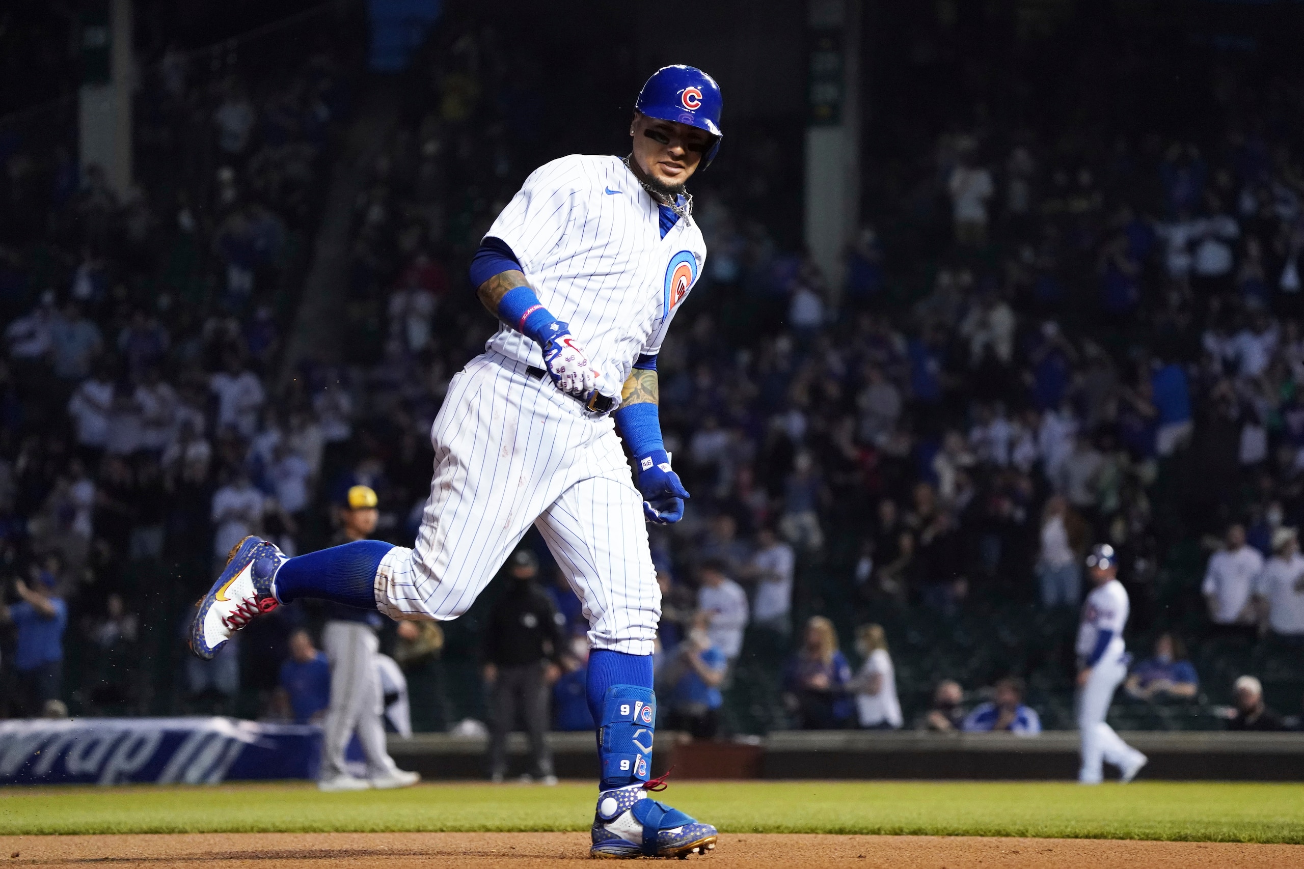 Chicago Cubs' Javier Baez runs the bases after hitting a home run against the Milwaukee Brewers during the fourth inning of a baseball game, Monday, April 5, 2021, in Chicago. (AP Photo/David Banks)