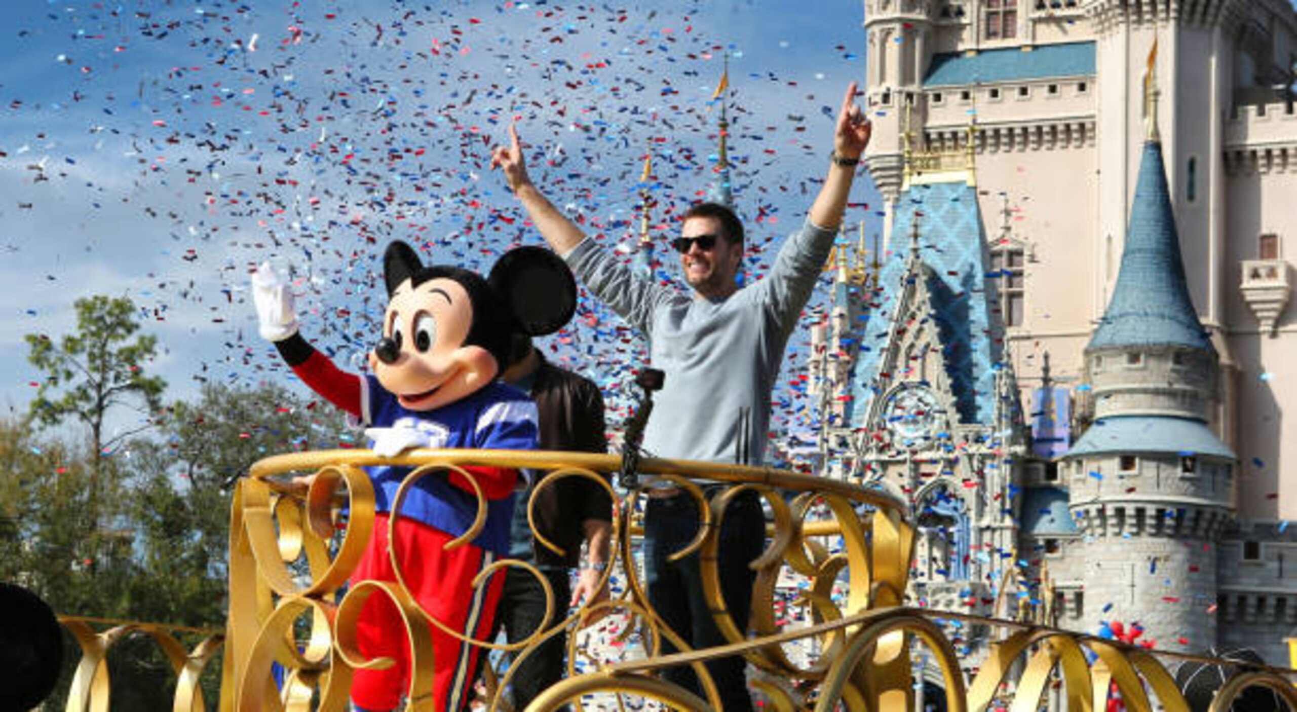 Super Bowl LIII winning quarterback Tom Brady of the New England Patriots celebrates with Mickey Mouse in the Super Bowl victory parade in the Magic Kingdom on Monday, February 4, 2019 at Walt Disney World, in Lake Buena Vista, Fla. (Joe Burbank/Orlando Sentinel/Tribune News Service via Getty Images)