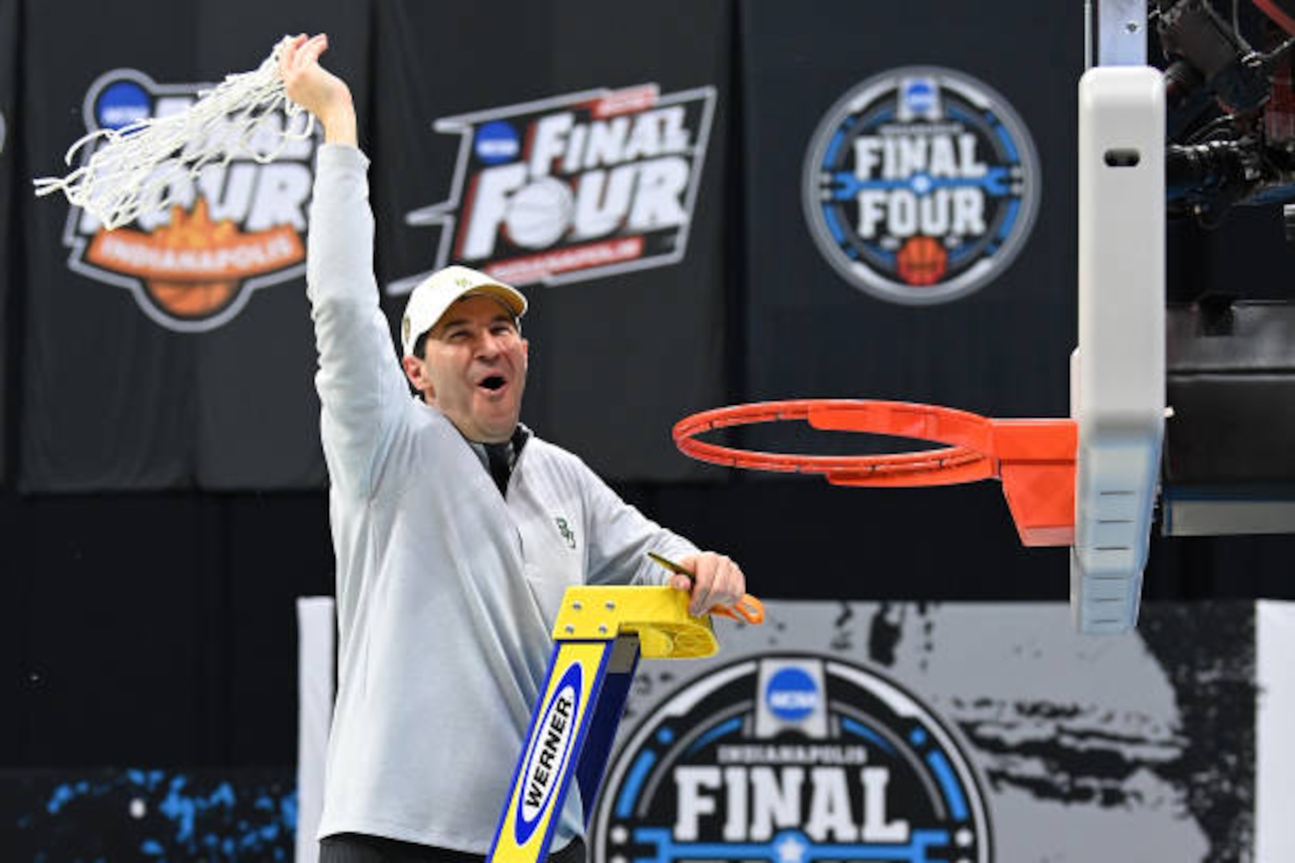 INDIANAPOLIS, INDIANA - APRIL 05: Head coach Scott Drew of the Baylor Bears cuts down the net after his team's win against the Gonzaga Bulldogs in the National Championship game of the 2021 NCAA Men's Basketball Tournament at Lucas Oil Stadium on April 05, 2021 in Indianapolis, Indiana. (Photo by Brett Wilhelm/NCAA Photos via Getty Images) INDIANAPOLIS, INDIANA - APRIL 05: Head coach Scott Drew of the Baylor Bears cuts down the net after his team's win against the Gonzaga Bulldogs in the National Championship game of the 2021 NCAA Men's Basketball Tournament at Lucas Oil Stadium on April 05, 2021 in Indianapolis, Indiana. (Photo by Brett Wilhelm/NCAA Photos via Getty Images)