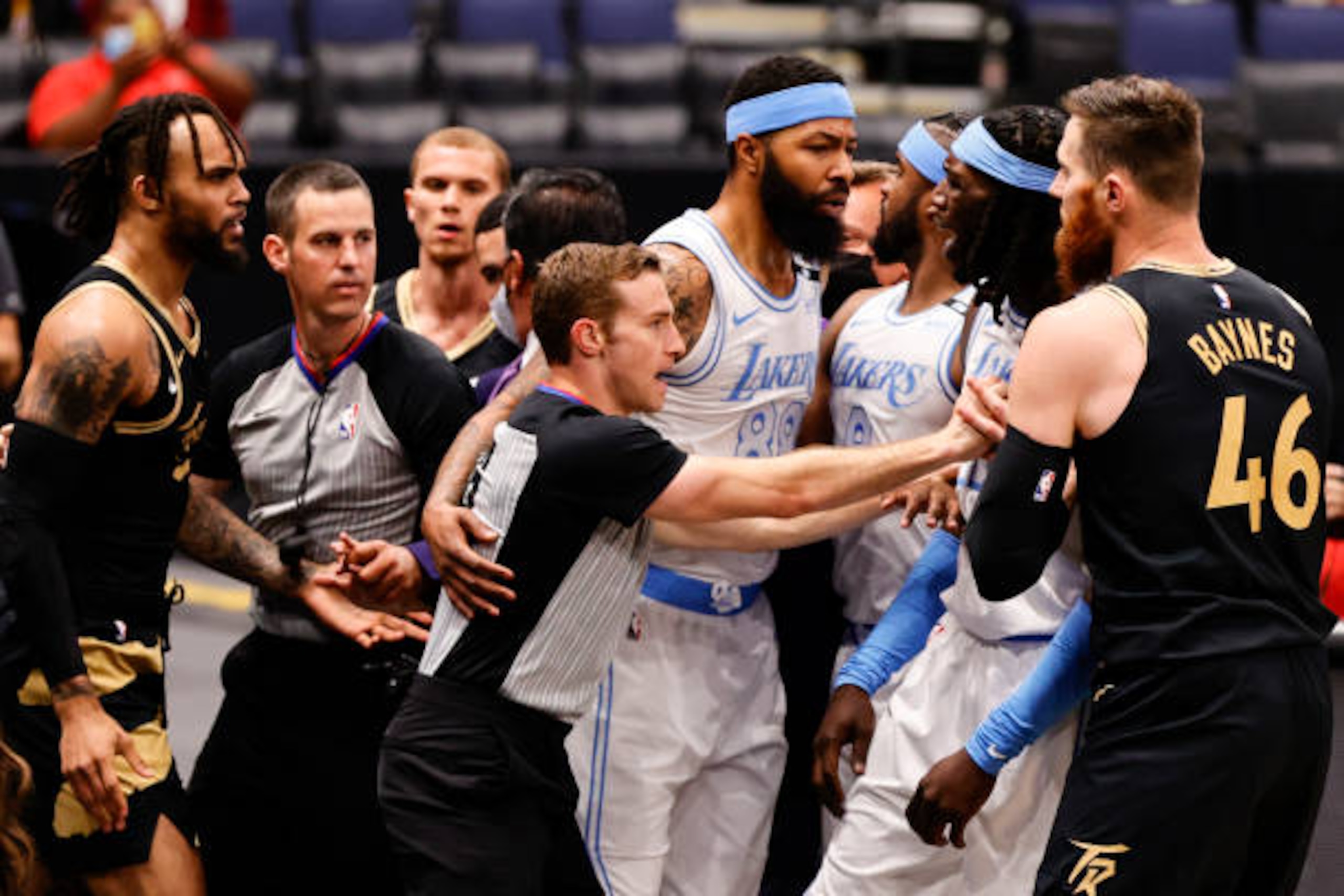 TAMPA, FLORIDA - APRIL 06: Toronto Raptors players and Los Angeles Lakers clear the bench and have words during the first quarter at Amalie Arena on April 06, 2021 in Tampa, Florida.NOTE TO USER: User expressly acknowledges and agrees that, by downloading and or using this photograph, User is consenting to the terms and conditions of the Getty Images License Agreement.  (Photo by Douglas P. DeFelice/Getty Images)