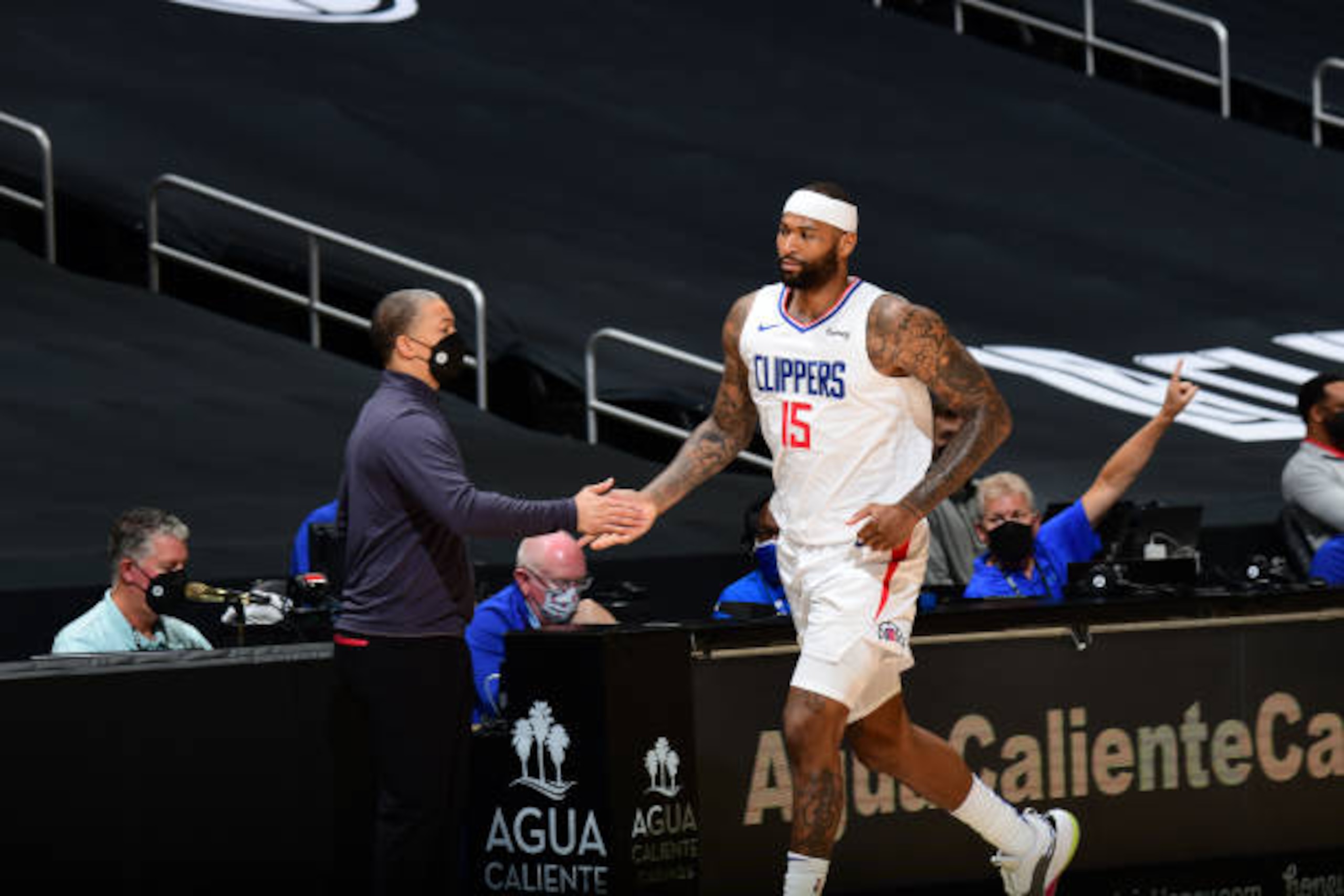 LOS ANGELES, CA - APRIL 6: DeMarcus Cousins #15 of the LA Clippers high fives Head Coach Tyronn Lue of the LA Clippers during the game against the Portland Trail Blazers on April 6, 2021 at STAPLES Center in Los Angeles, California. NOTE TO USER: User expressly acknowledges and agrees that, by downloading and/or using this Photograph, user is consenting to the terms and conditions of the Getty Images License Agreement. Mandatory Copyright Notice: Copyright 2021 NBAE (Photo by Adam Pantozzi/NBAE via Getty Images)