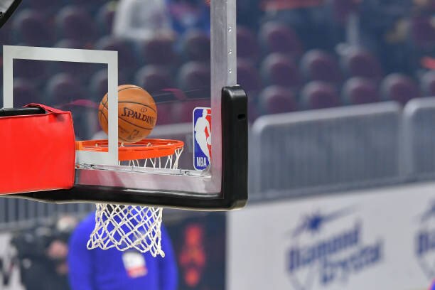 CLEVELAND, OHIO - APRIL 01: An official Spalding basketball falls through the rim next to the NBA logo on a backboard prior to the game between the Cleveland Cavaliers and the Philadelphia 76ers at Rocket Mortgage Fieldhouse on April 01, 2021 in Cleveland, Ohio. NOTE TO USER: User expressly acknowledges and agrees that, by downloading and/or using this photograph, user is consenting to the terms and conditions of the Getty Images License Agreement. (Photo by Jason Miller/Getty Images)