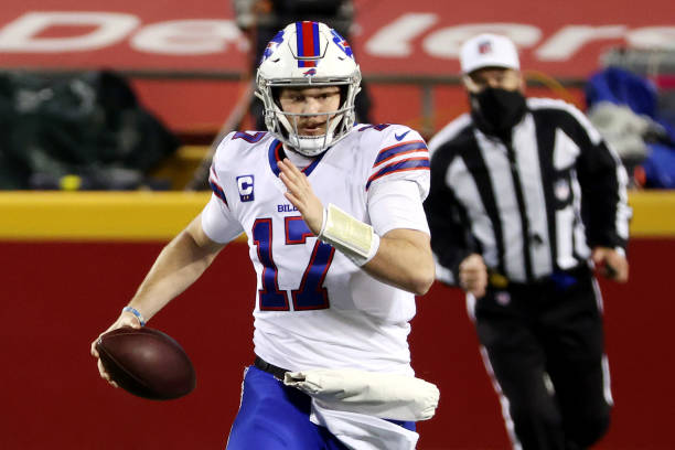 KANSAS CITY, MISSOURI - JANUARY 24: Josh Allen #17 of the Buffalo Bills runs with the ball in the first quarter against the Kansas City Chiefs during the AFC Championship game at Arrowhead Stadium on January 24, 2021 in Kansas City, Missouri. (Photo by Jamie Squire/Getty Images)