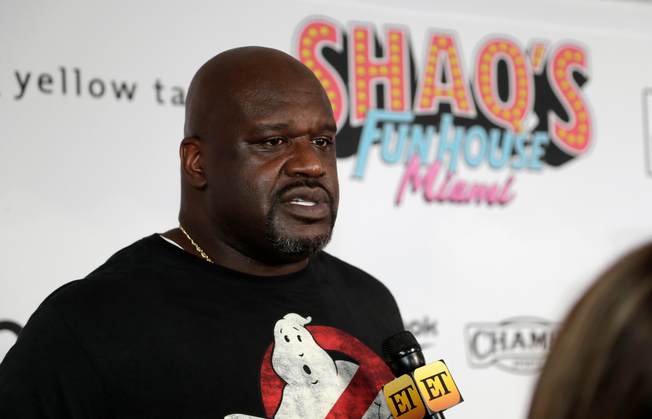 Former NBA player Shaquille O' Neal is interviewed on the red carpet for Shaq's Fun House, Friday, Jan. 31, 2020, in Miami. This carnival themed music festival is one of numerous events taking place in advance of Miami hosting Super Bowl LIV on Feb. 2. (AP Photo/Lynne Sladky)