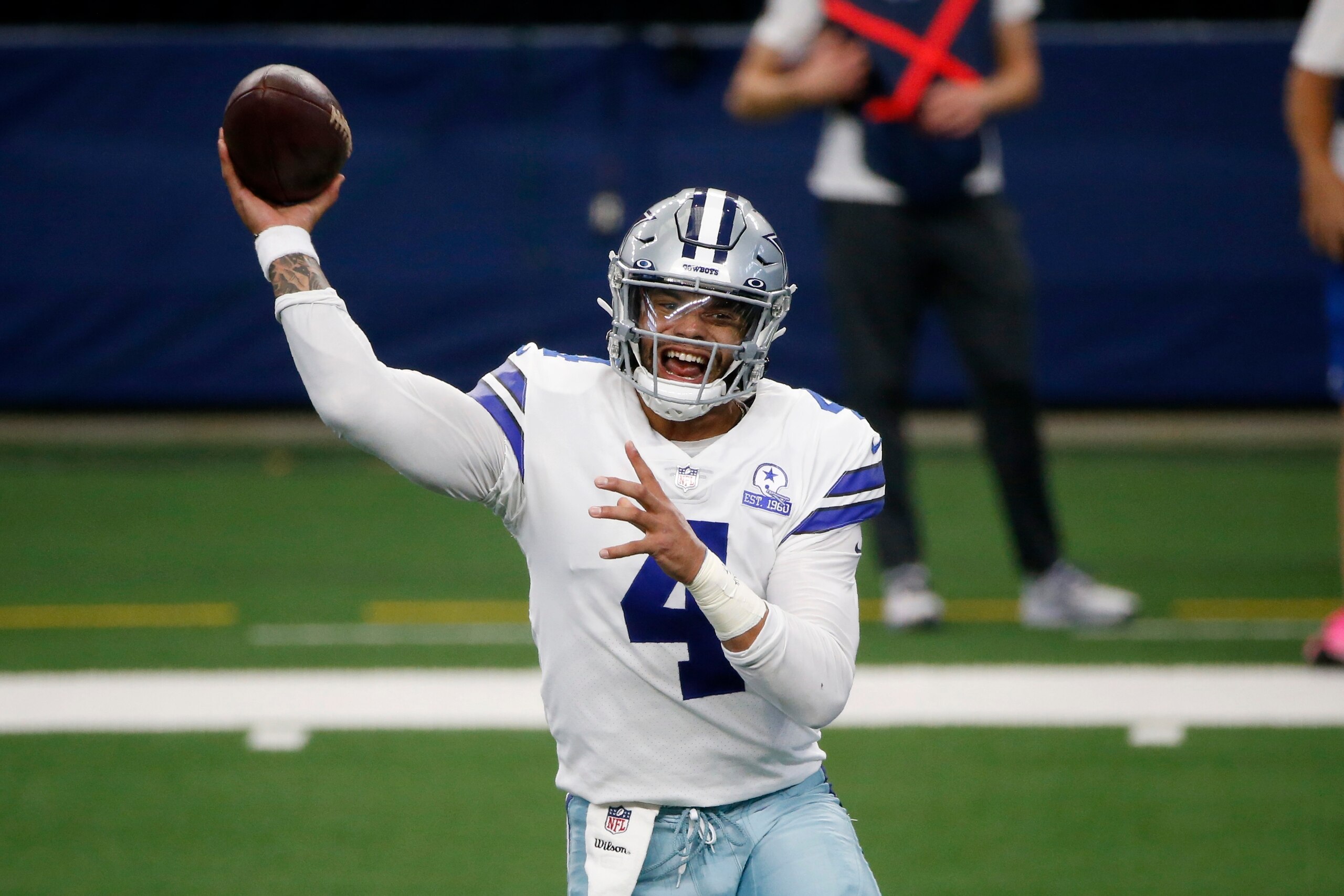Dallas Cowboys quarterback Dak Prescott throws a pass in the first half of an NFL football game against the New York Giants in Arlington, Texas, Sunday, Oct. 11, 2020. (AP Photo/Michael Ainsworth)