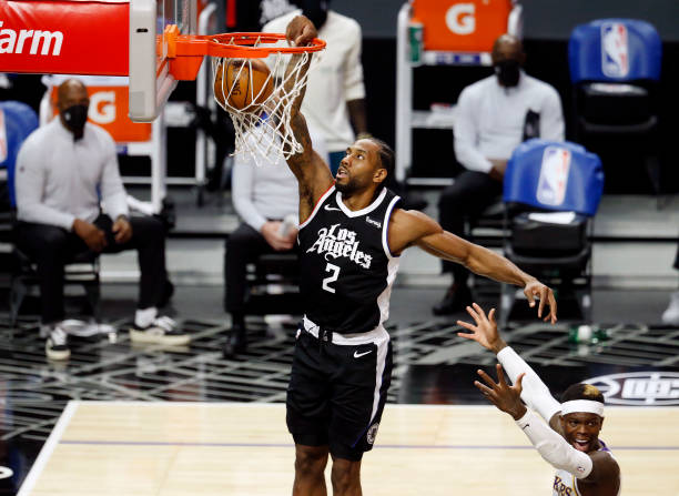 LOS ANGELES, CA - APRIL 04: LA Clippers forward Kawhi Leonard (2) slam dunks the ball against the Los Angeles Lakers in the first quarter at the Staples Center on Sunday, April 4, 2021 in Los Angeles, CA. (Photo by Gary Coronado / Los Angeles Times via Getty Images)