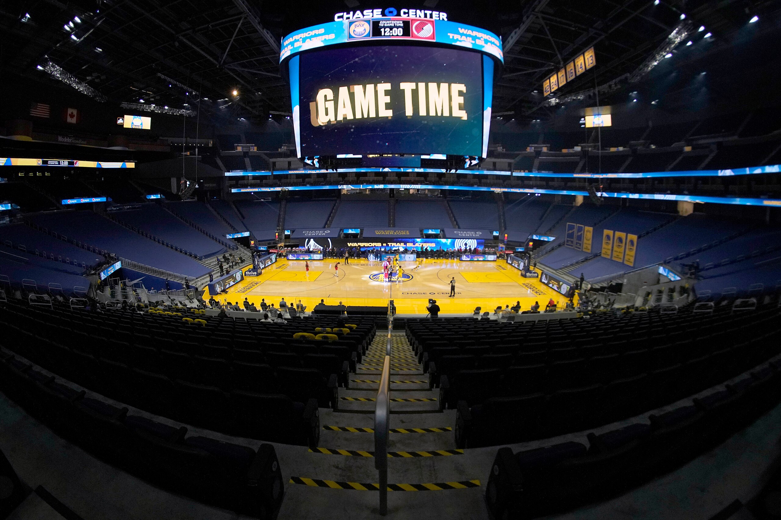 Empty seats at Chase Center are viewed during the tip-off of an NBA basketball game between the Golden State Warriors and the Portland Trail Blazers in San Francisco, Sunday, Jan. 3, 2021. (AP Photo/Tony Avelar) Empty seats at Chase Center are viewed during the tip-off of an NBA basketball game between the Golden State Warriors and the Portland Trail Blazers in San Francisco, Sunday, Jan. 3, 2021. (AP Photo/Tony Avelar)