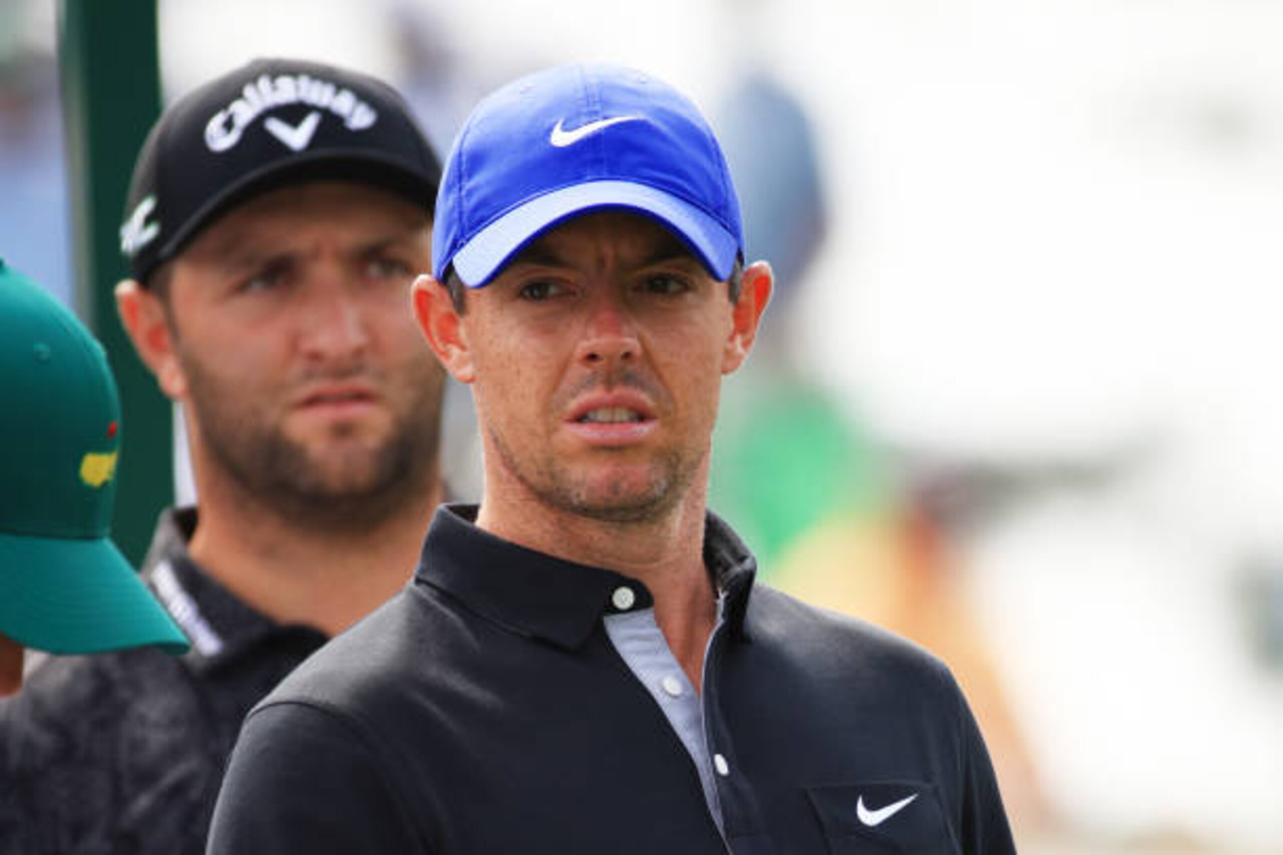 AUGUSTA, GEORGIA - APRIL 08: Rory McIlroy of Northern Ireland and Jon Rahm of Spain look on from the third tee during the first round of the Masters at Augusta National Golf Club on April 08, 2021 in Augusta, Georgia. (Photo by Mike Ehrmann/Getty Images)