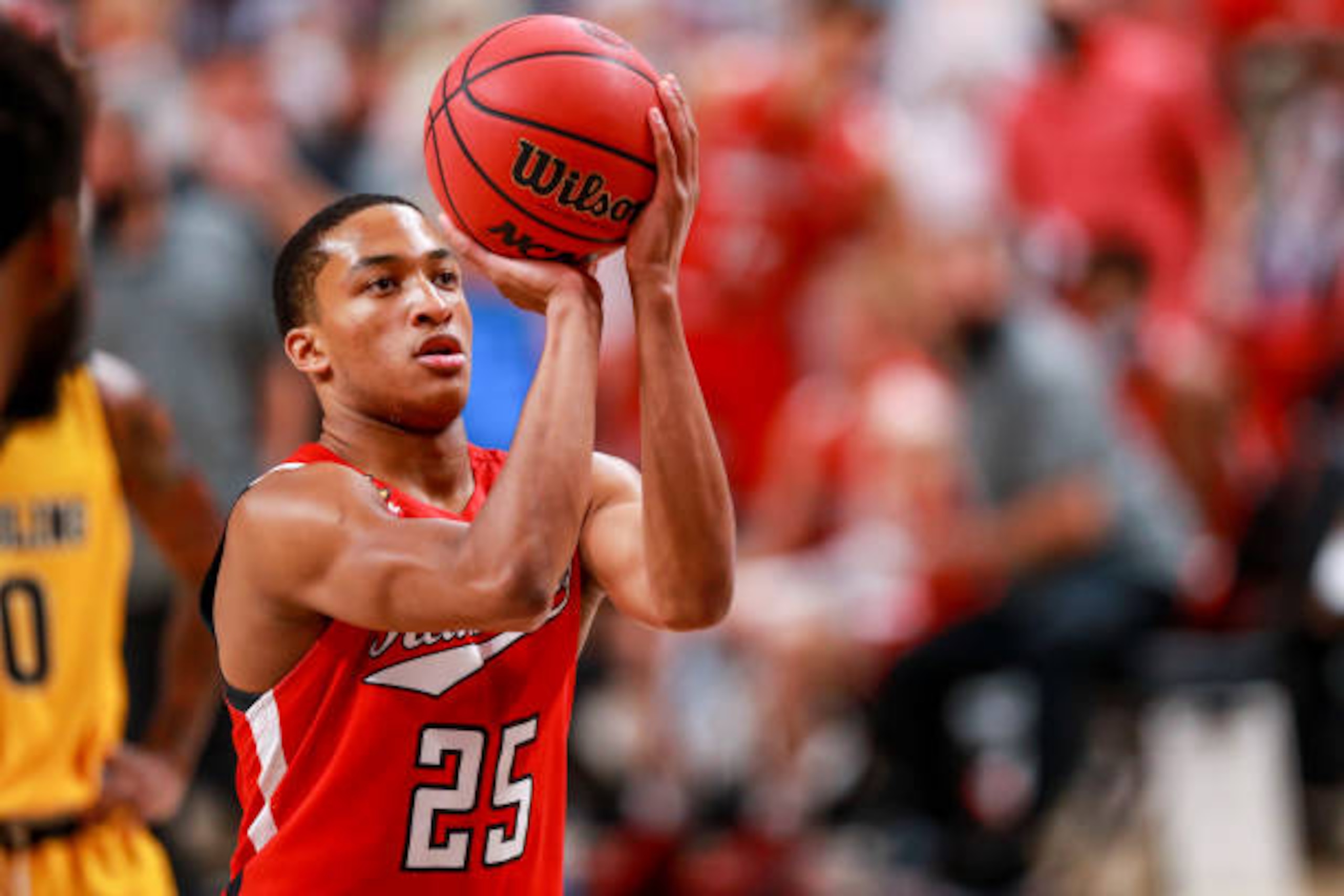 LUBBOCK, TEXAS - DECEMBER 06: Guard Nimari Burnett #25 of the Texas Tech Red Raiders shoots a free throw during the first half of the college basketball game against the Grambling State Tigers at United Supermarkets Arena on December 06, 2020 in Lubbock, Texas. (Photo by John E. Moore III/Getty Images)