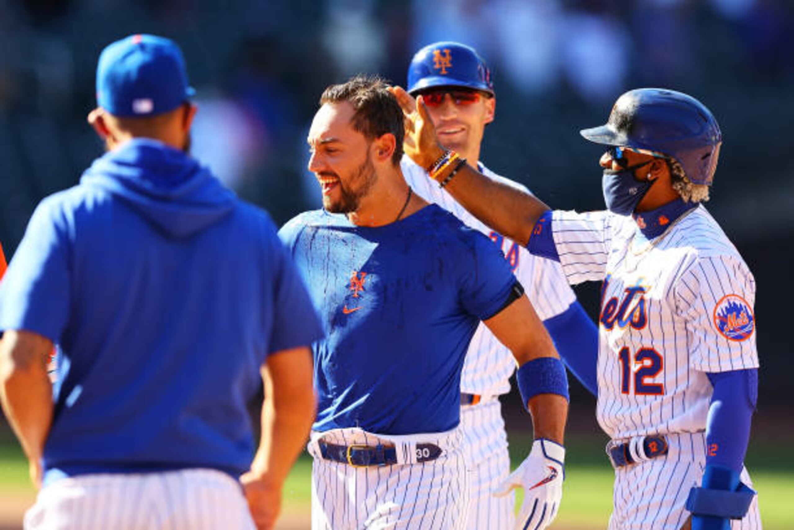 NEW YORK, NEW YORK - APRIL 08: Michael Conforto #30 of the New York Mets celebrates after being hit by a pitch with the bases loaded to force in the winning run in the bottom of the ninth inning against the Miami Marlins at Citi Field on April 08, 2021 in New York City. (Photo by Mike Stobe/Getty Images)