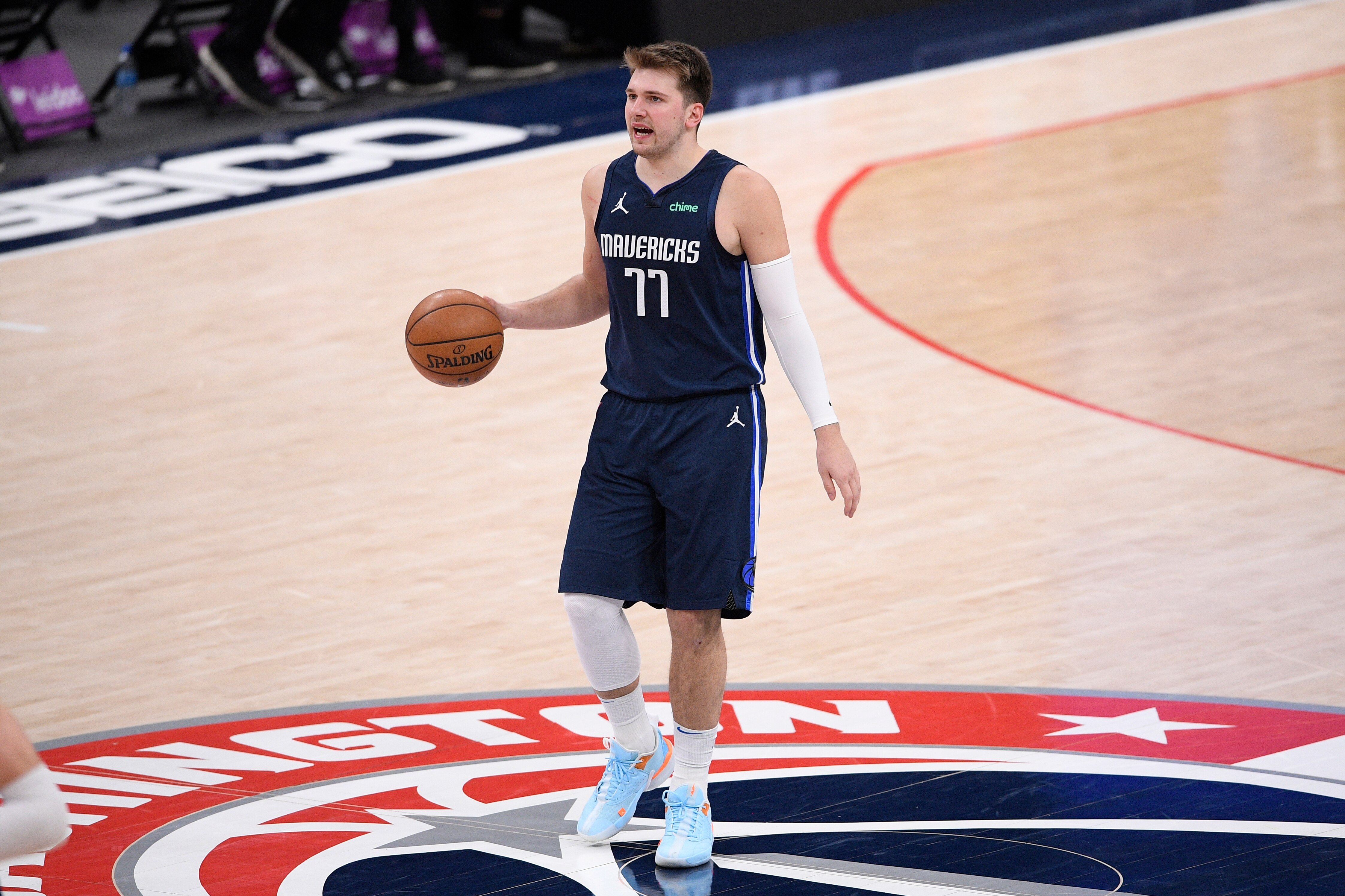 Dallas Mavericks guard Luka Doncic (77) dribbles the ball during the second half of an NBA basketball game against the Washington Wizards, Saturday, April 3, 2021, in Washington. (AP Photo/Nick Wass)